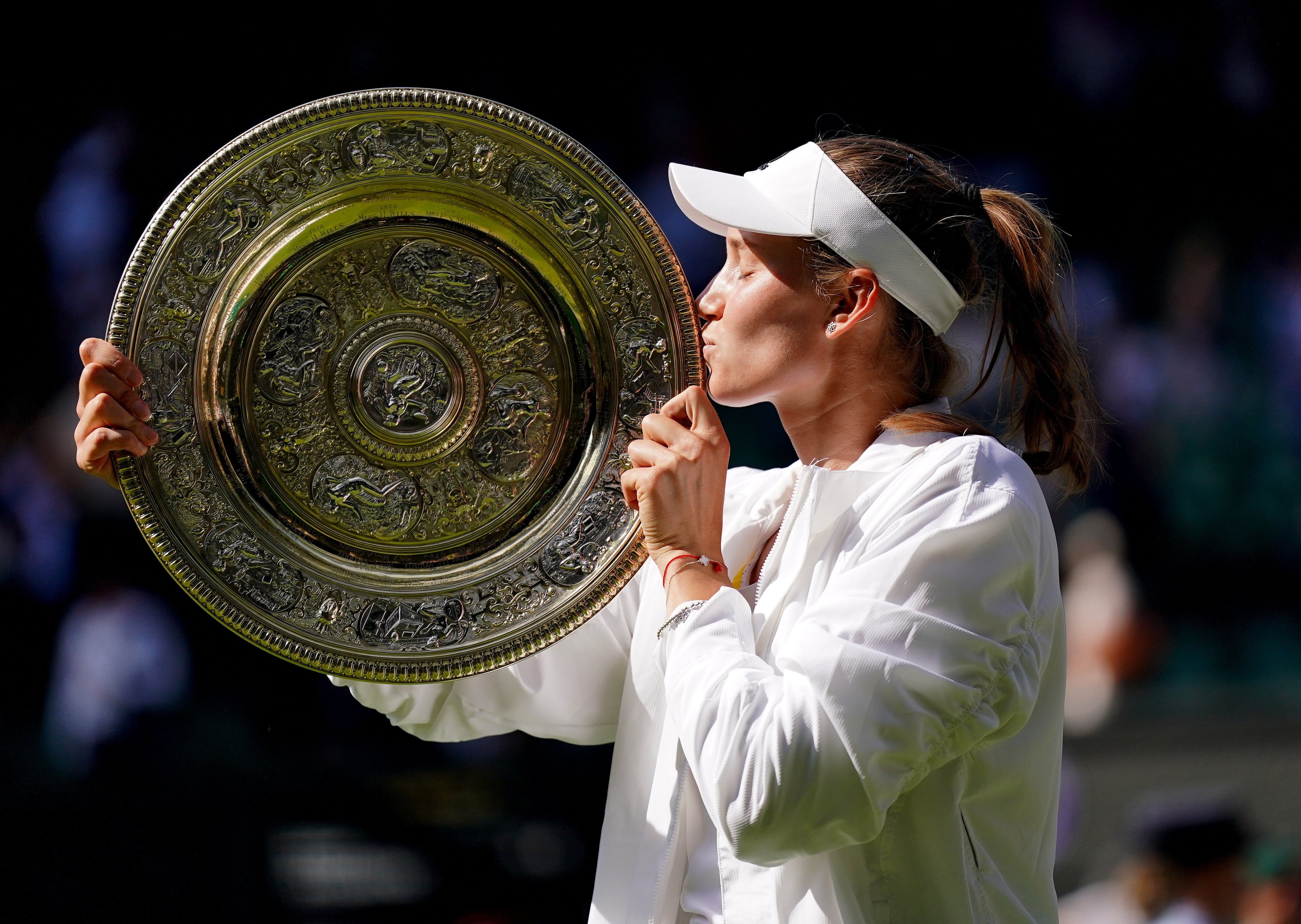 Elena Rybakina kisses the Venus Rosewater Dish (Zac Goodwin/PA)