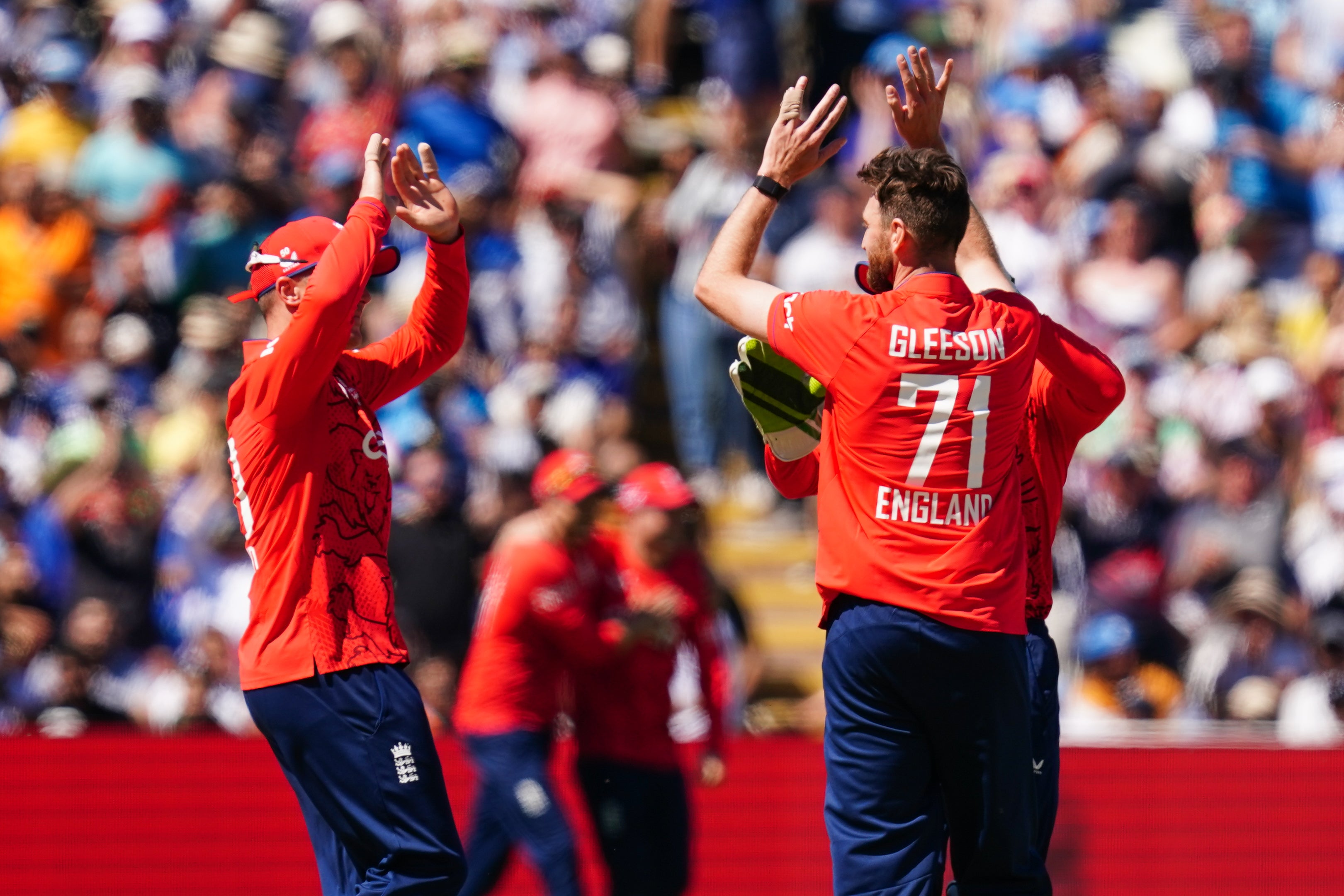 Richard Gleeson, right, celebrates the wicket of Virat Kohli (David Davies/PA)