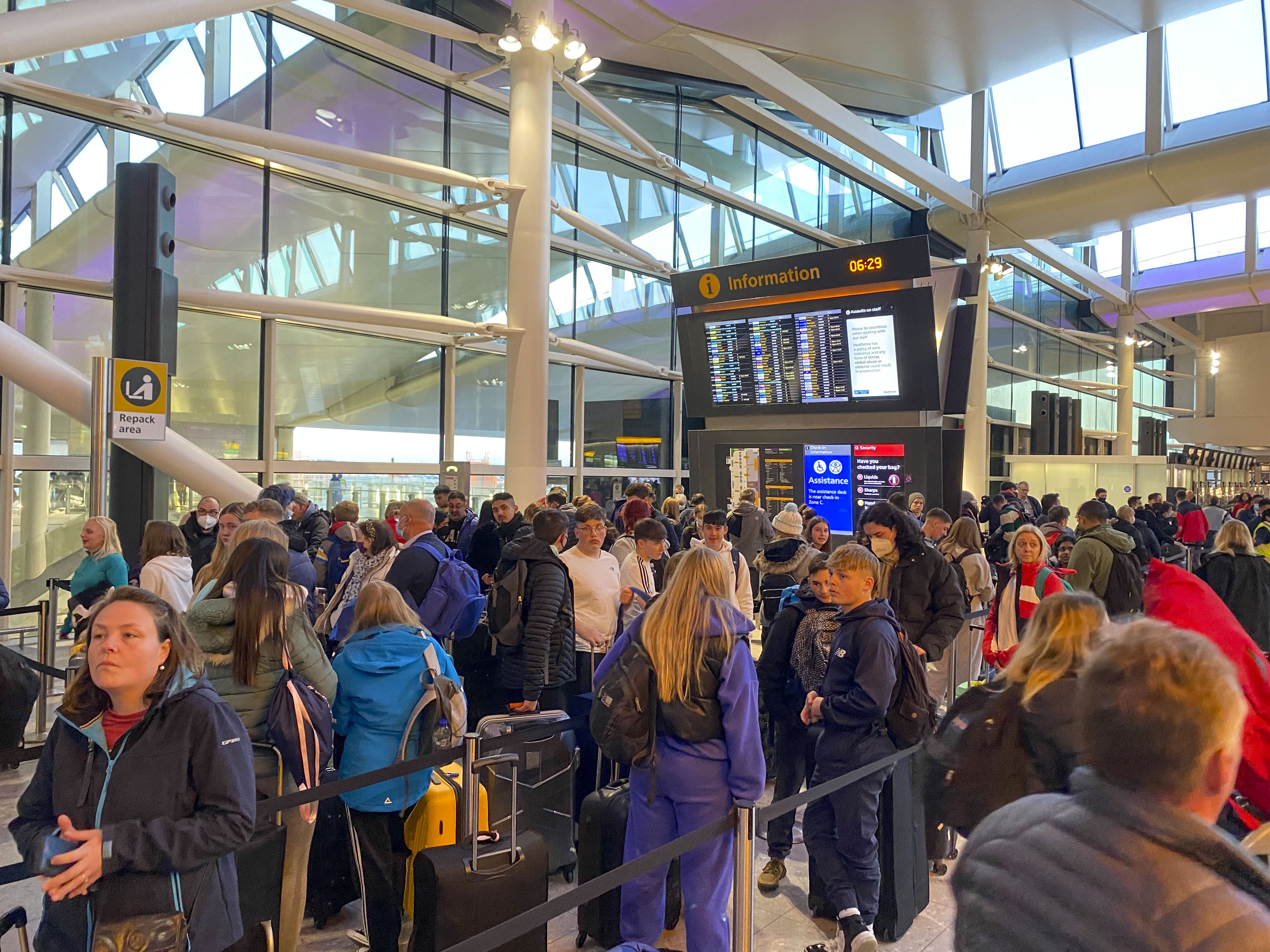 Passengers check-in in terminal 2 at Heathrow Airport, west London as the getaway starts in earnest (Steve Parsons/PA)