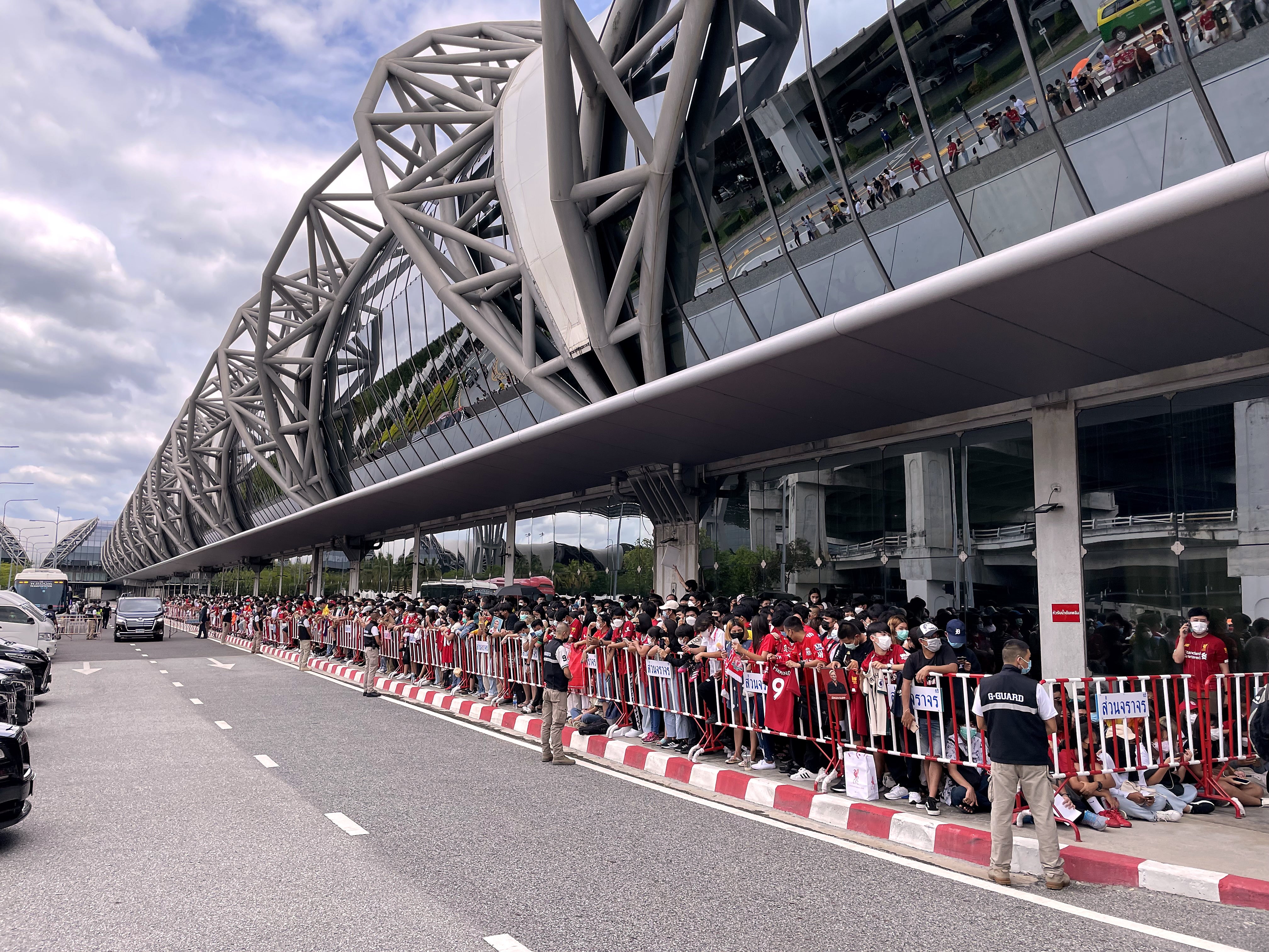 Liverpool fans lined the roads around the airport hoping to see the players (Simon Peach/PA)