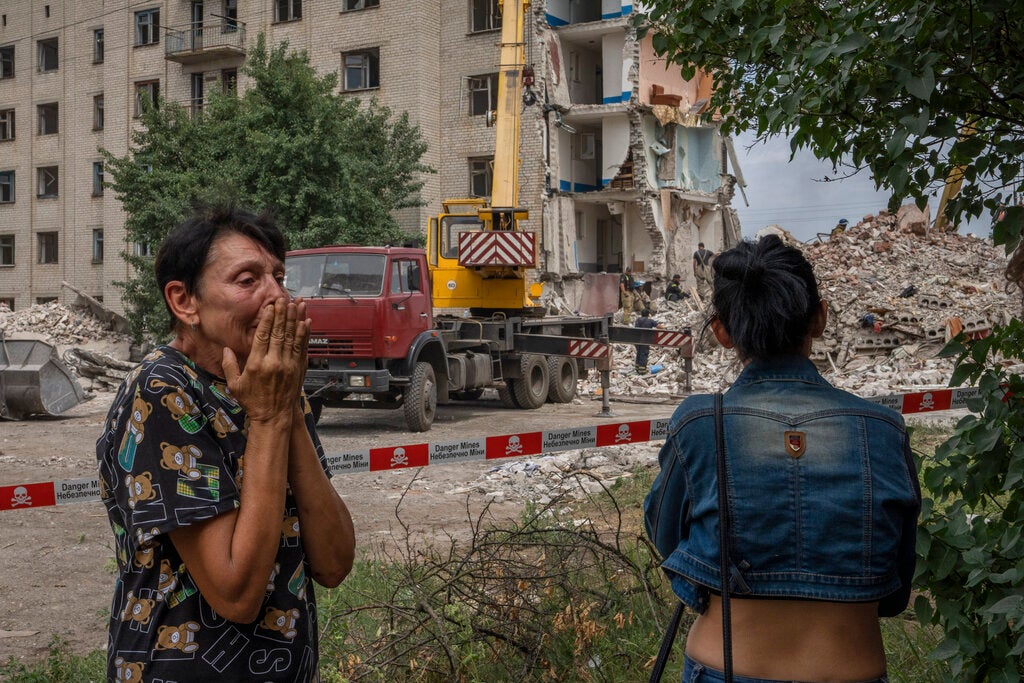 Iryna Shulimova (left) said she ran to the safety of a corridor with her dogs during the attack