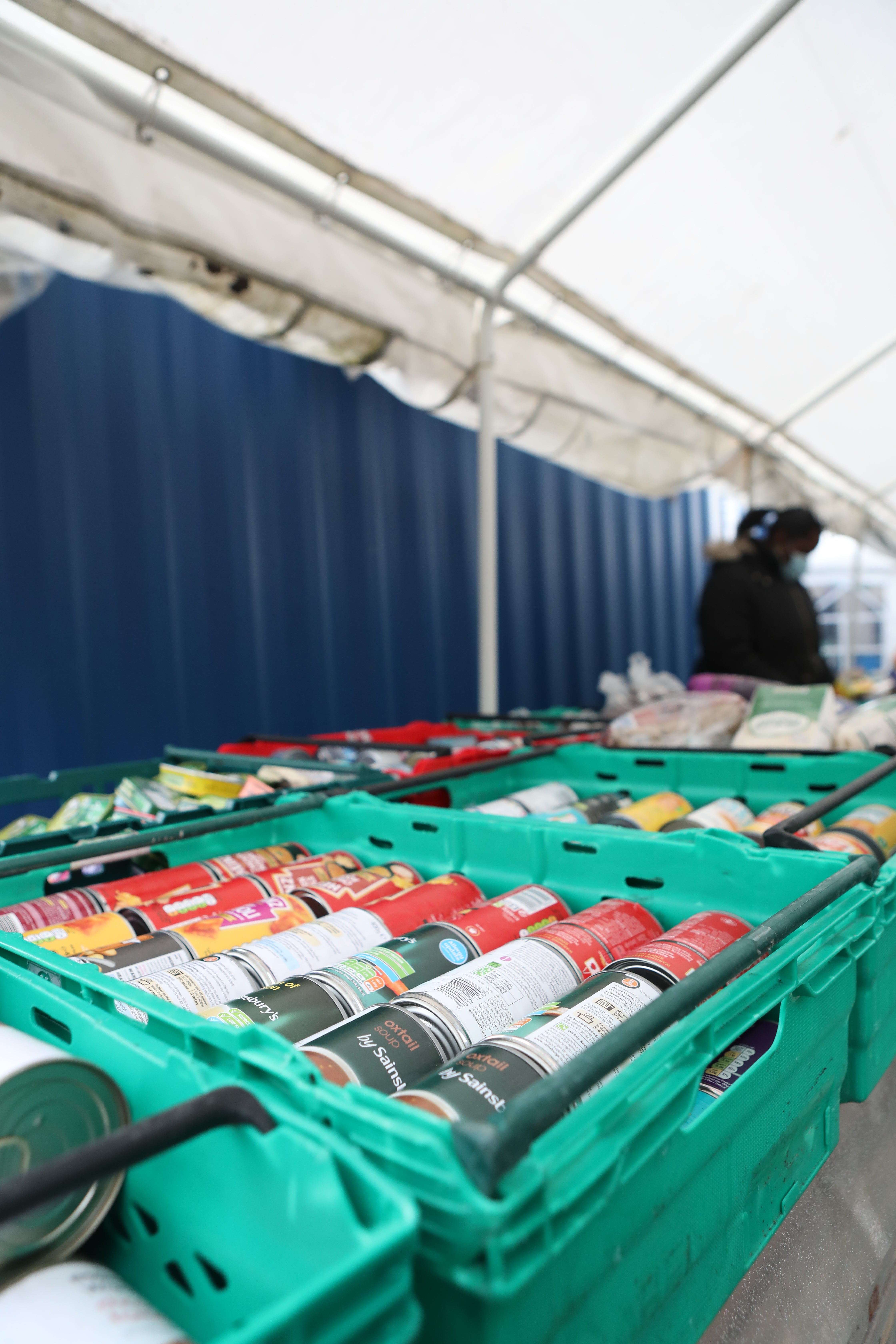 Food laid out in crates at a food bank (Luciana Guerra/PA)