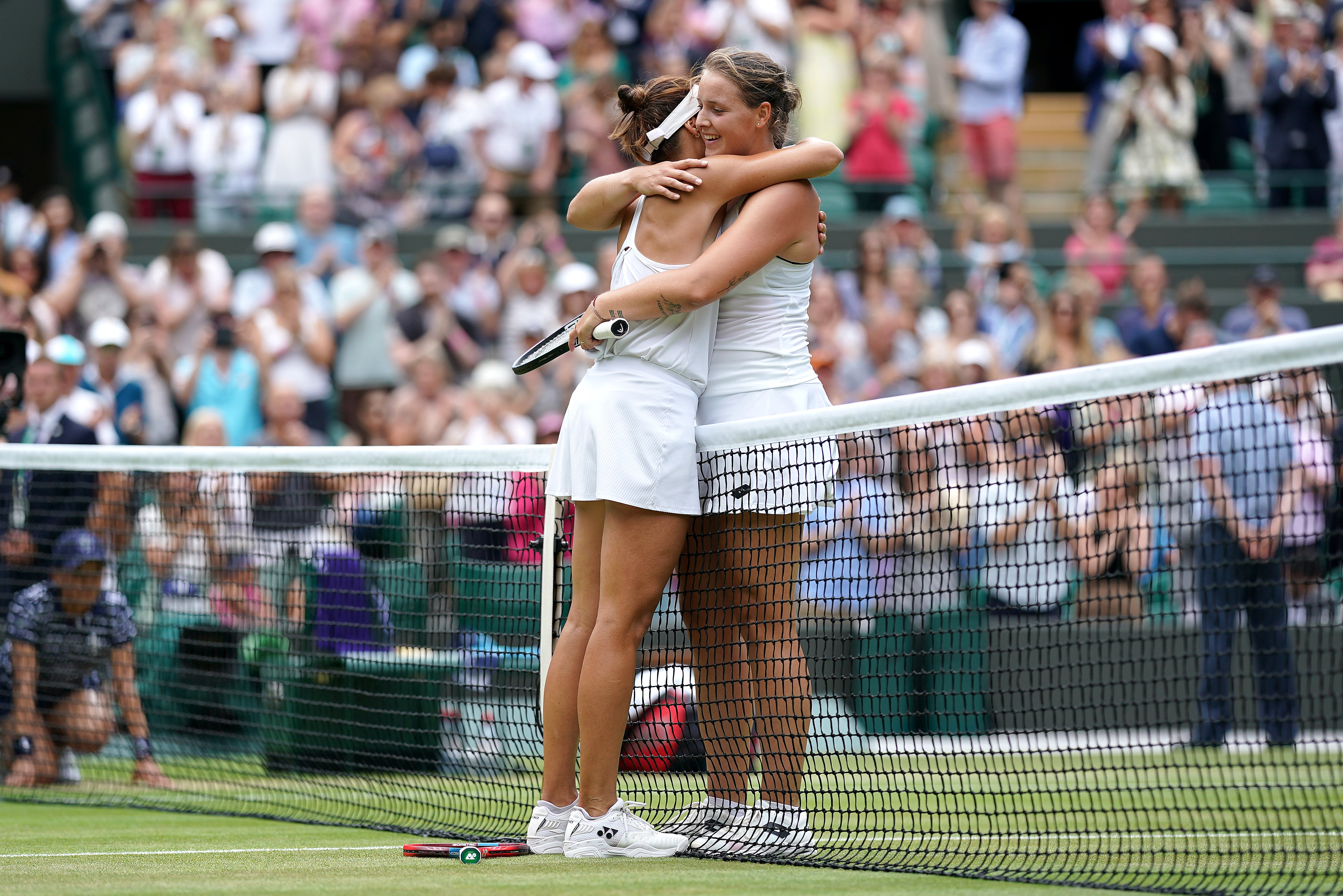 Mum-of-two Tatjana Maria (left) hugs fellow German Jule Niemeier after beating her in three sets to reach the semi-finals (Zac Goodwin/PA)