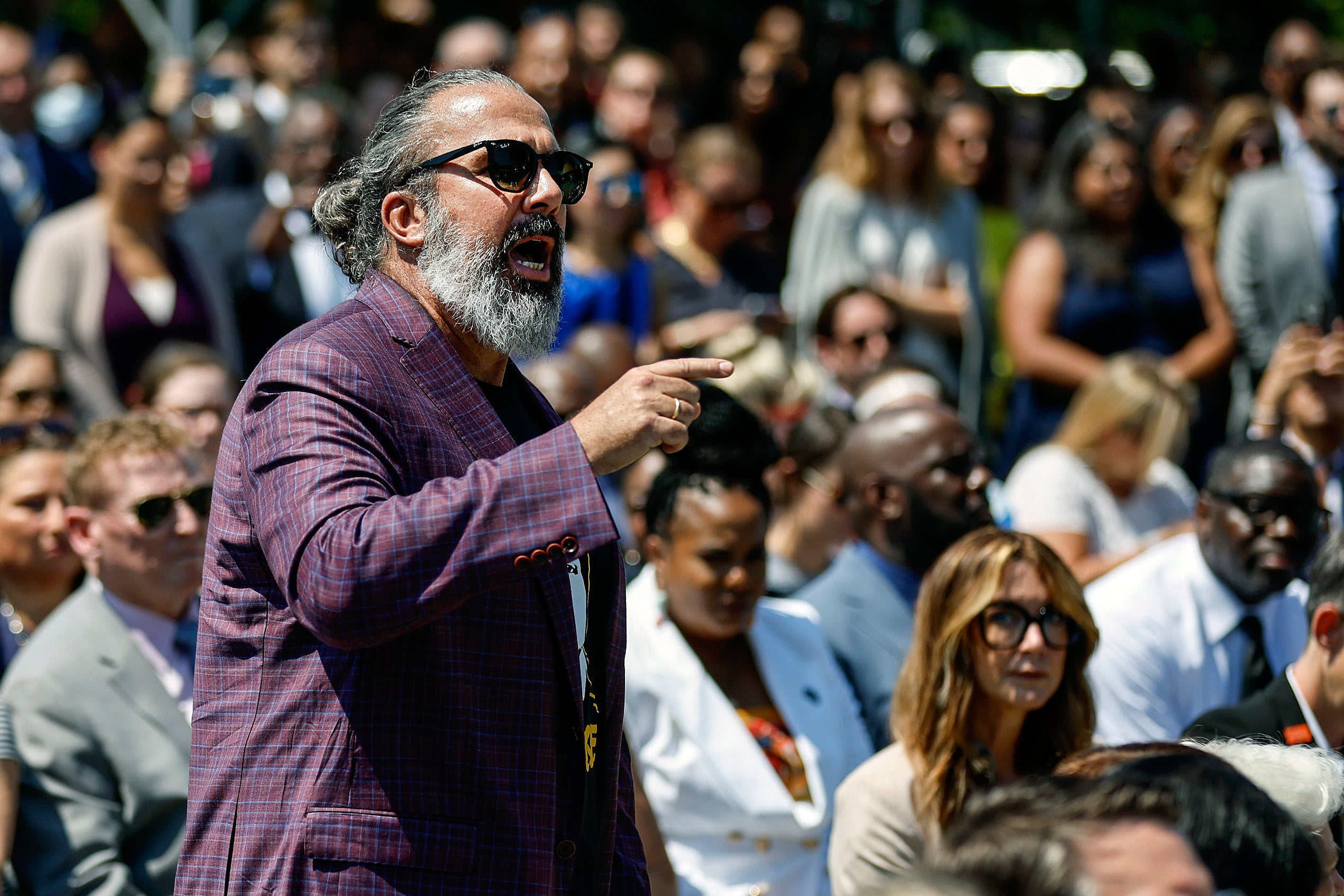 Manuel Oliver, whose son Joaquin was killed in the Parkland mass shooting, interrupts U.S. President Joe Biden as he delivers remarks