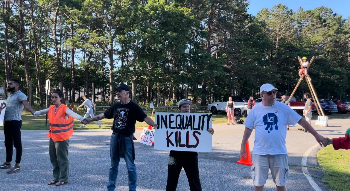 Climate protesters block off access to the airport in East Hampton, NY on Monday