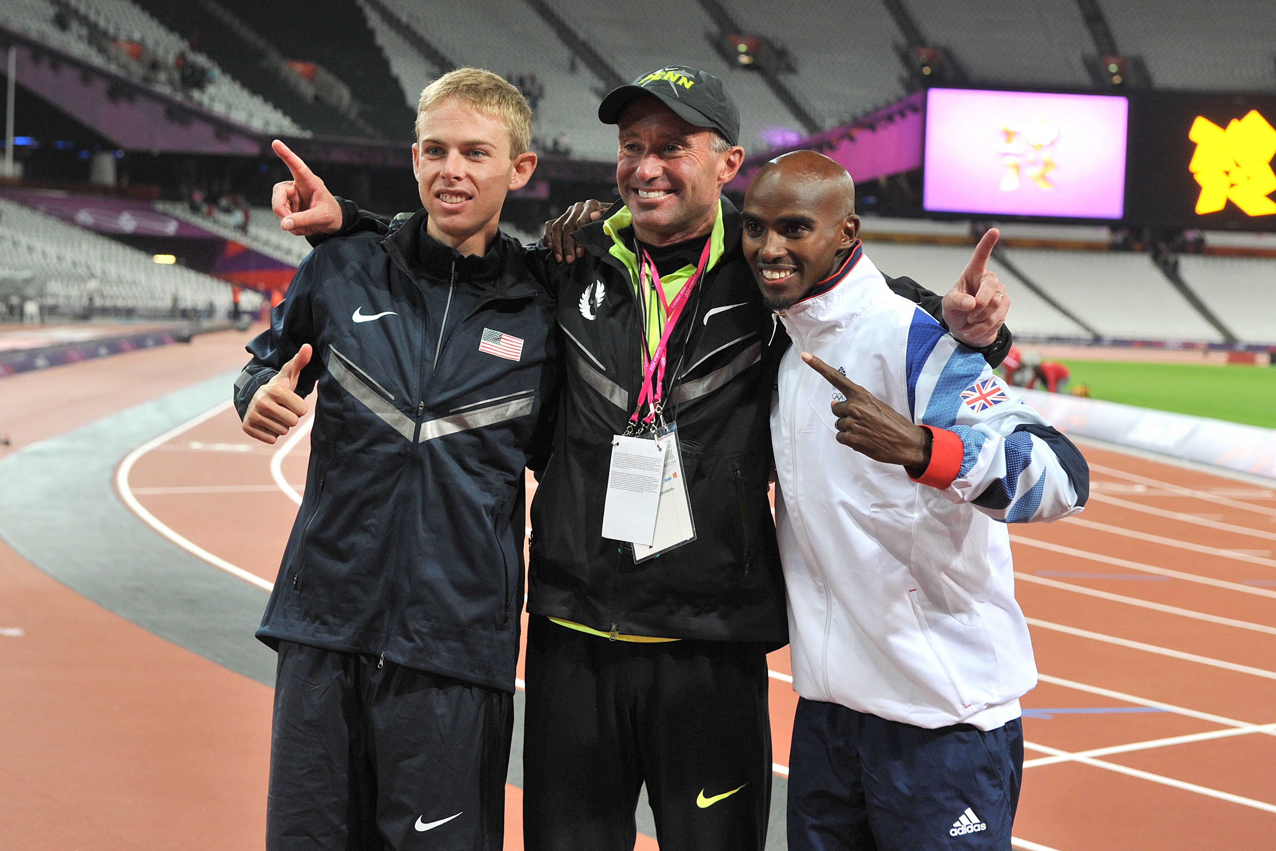 Farah (right) won his gold medals in London under Salazar. (Martin Rickett/PA)