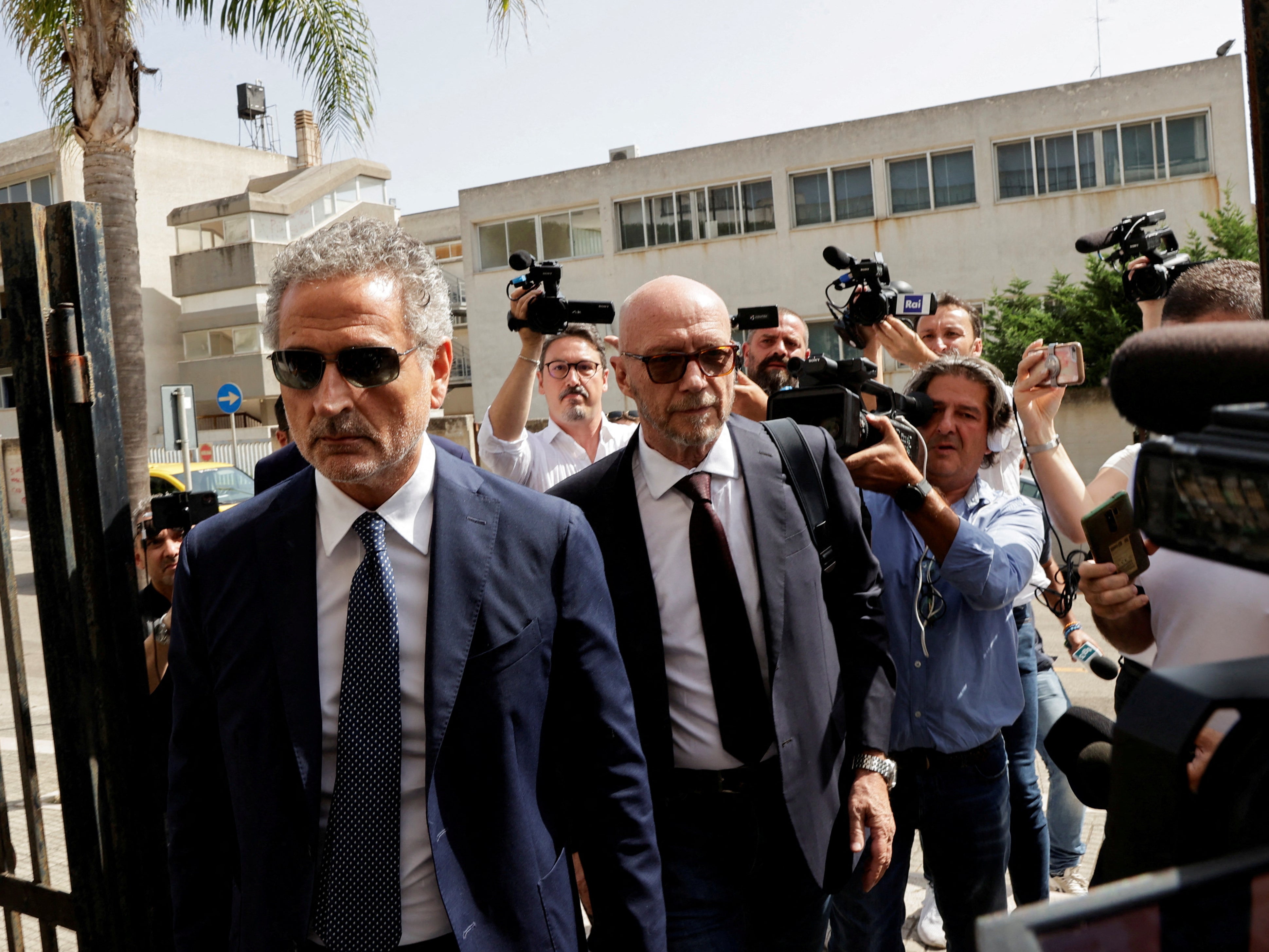 Haggis (centre) arrives for a hearing to be questioned by a judge following his arrest in Italy