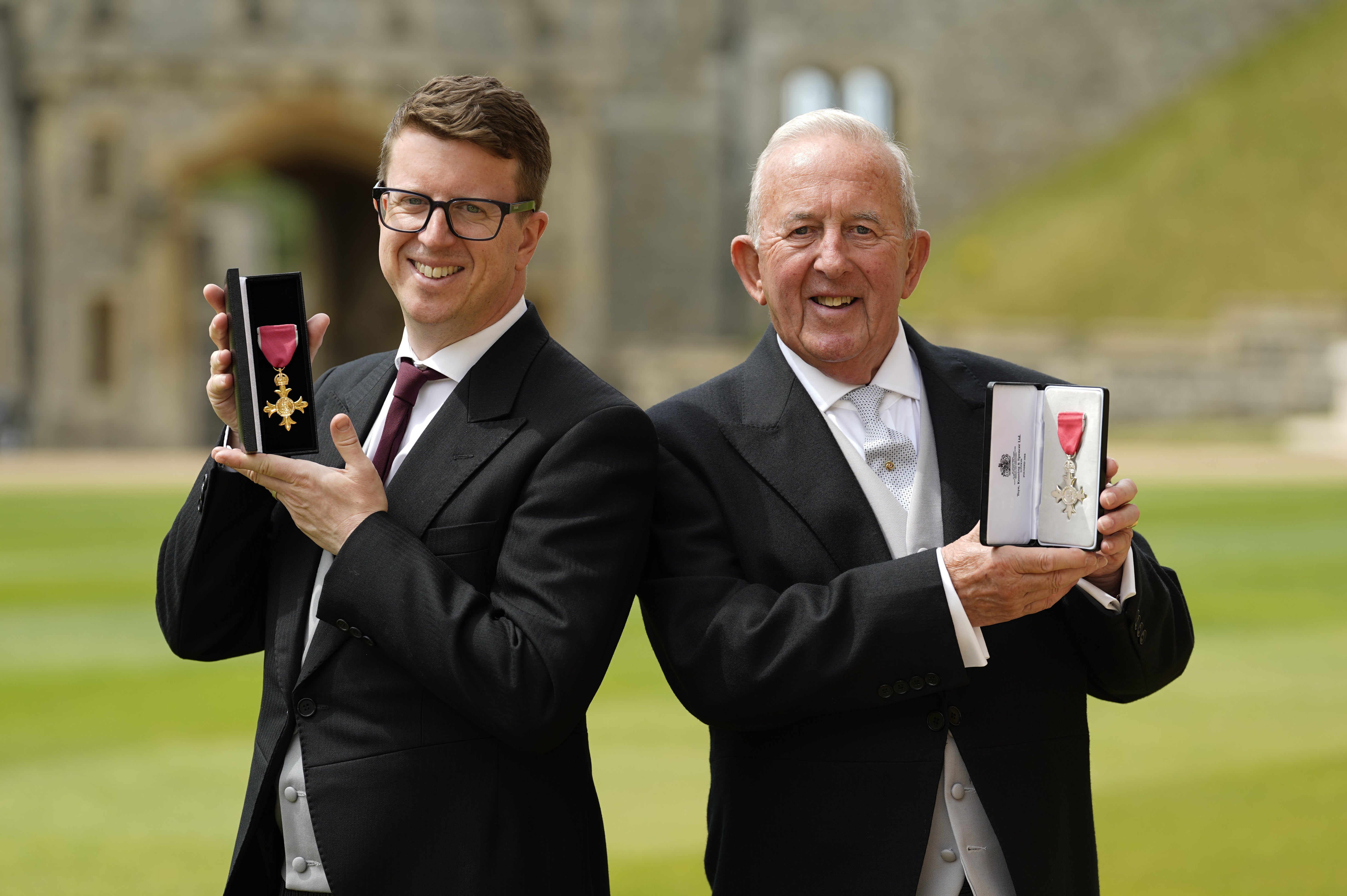 Matthew Hyde and his father Richard Hyde after being made OBE and MBE respectively at an investiture ceremony at Windsor Castle (Andrew Matthews/PA)