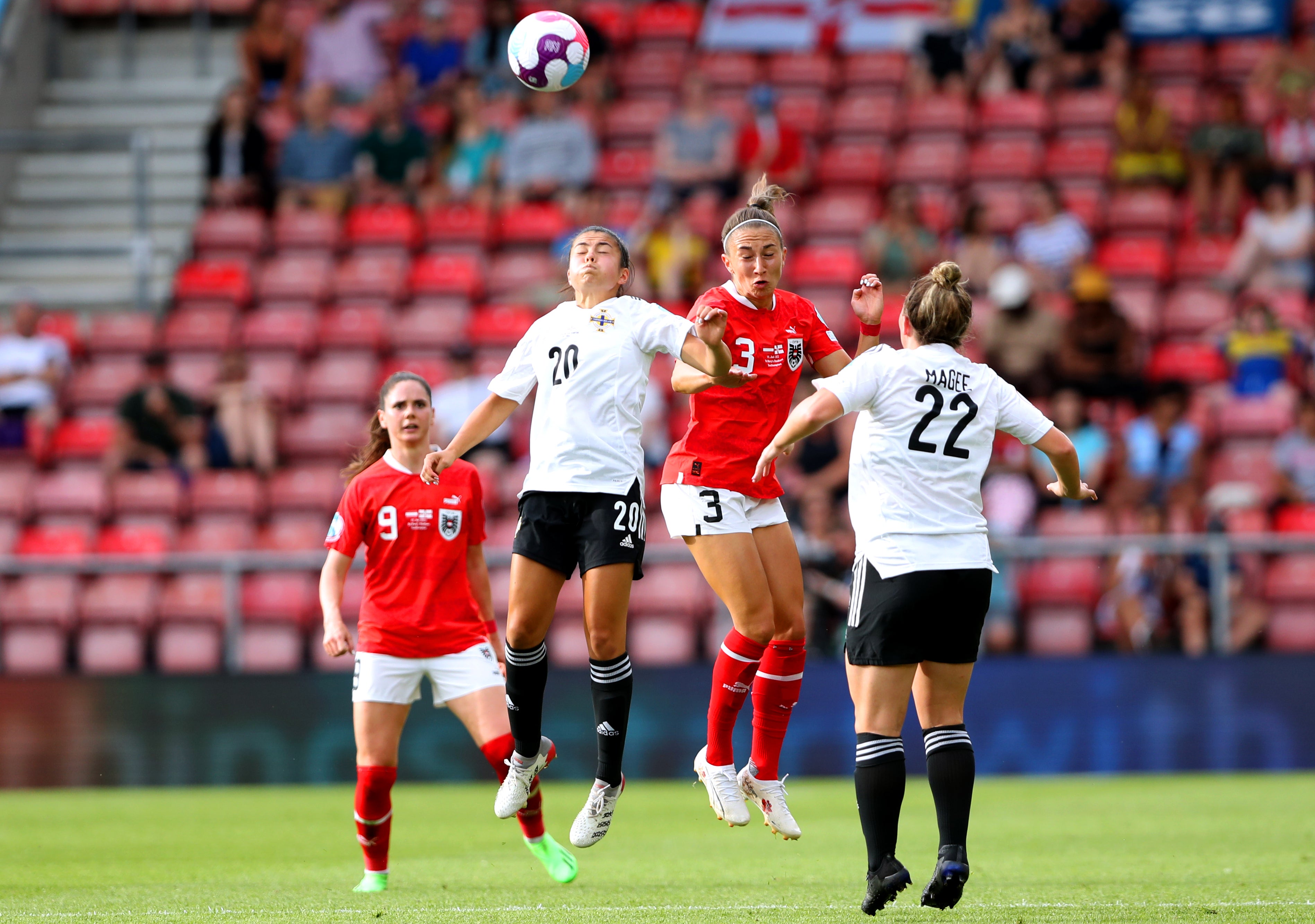 Northern Ireland’s Joely Andrews, second left, challenges Austria goalscorer Katharina Naschenweng during Monday’s 2-0 loss at St Mary’s (Kieran Cleeves/PA)