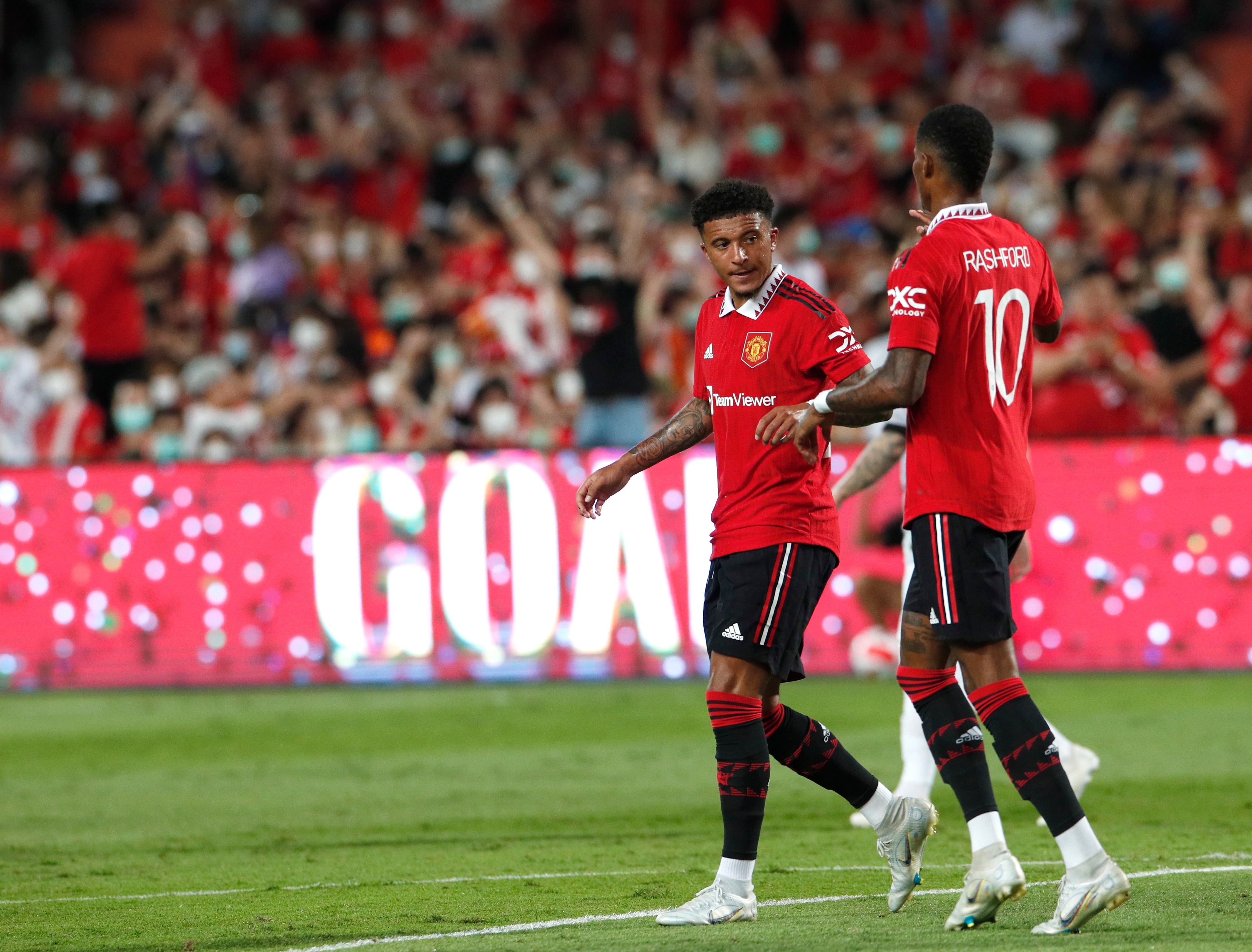 Jadon Sancho is congratulated by Marcus Rashford