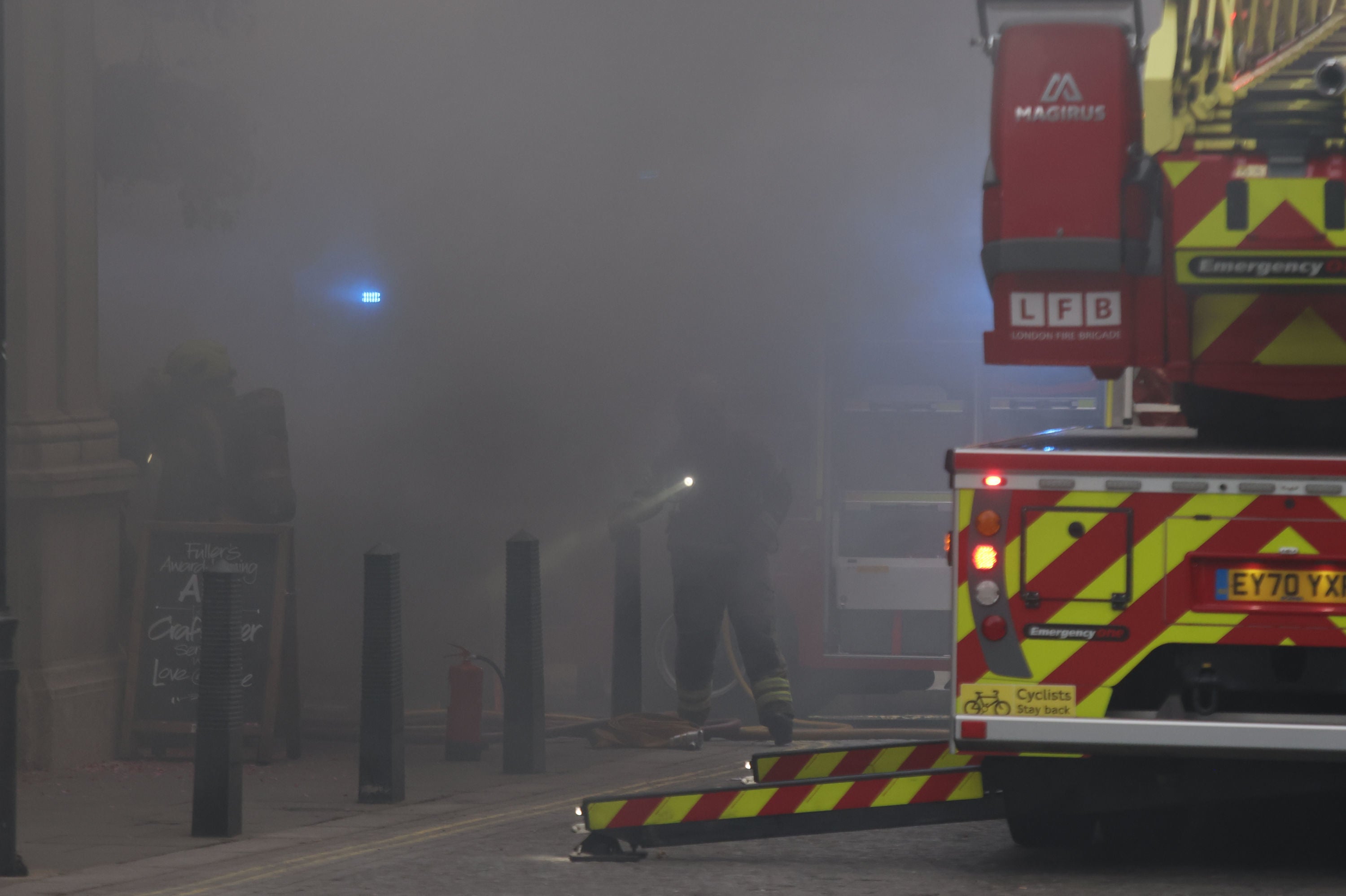 Thick smoke cloaks the street outside Admiral pub