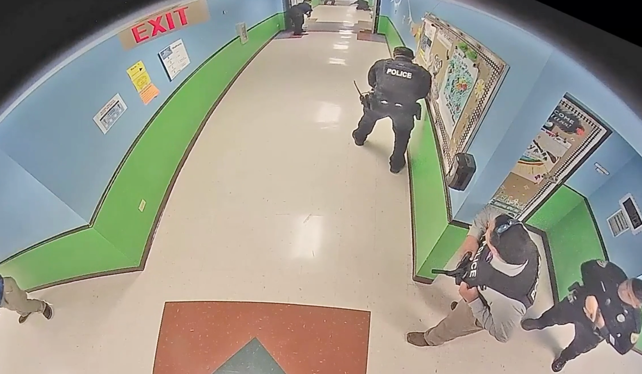 Police enter Robb Elementary School minutes after a gunman walked inside unimpeded and opened fire into a fourth-grade classroom on 24 May. More than an hour would pass before officers engaged him.