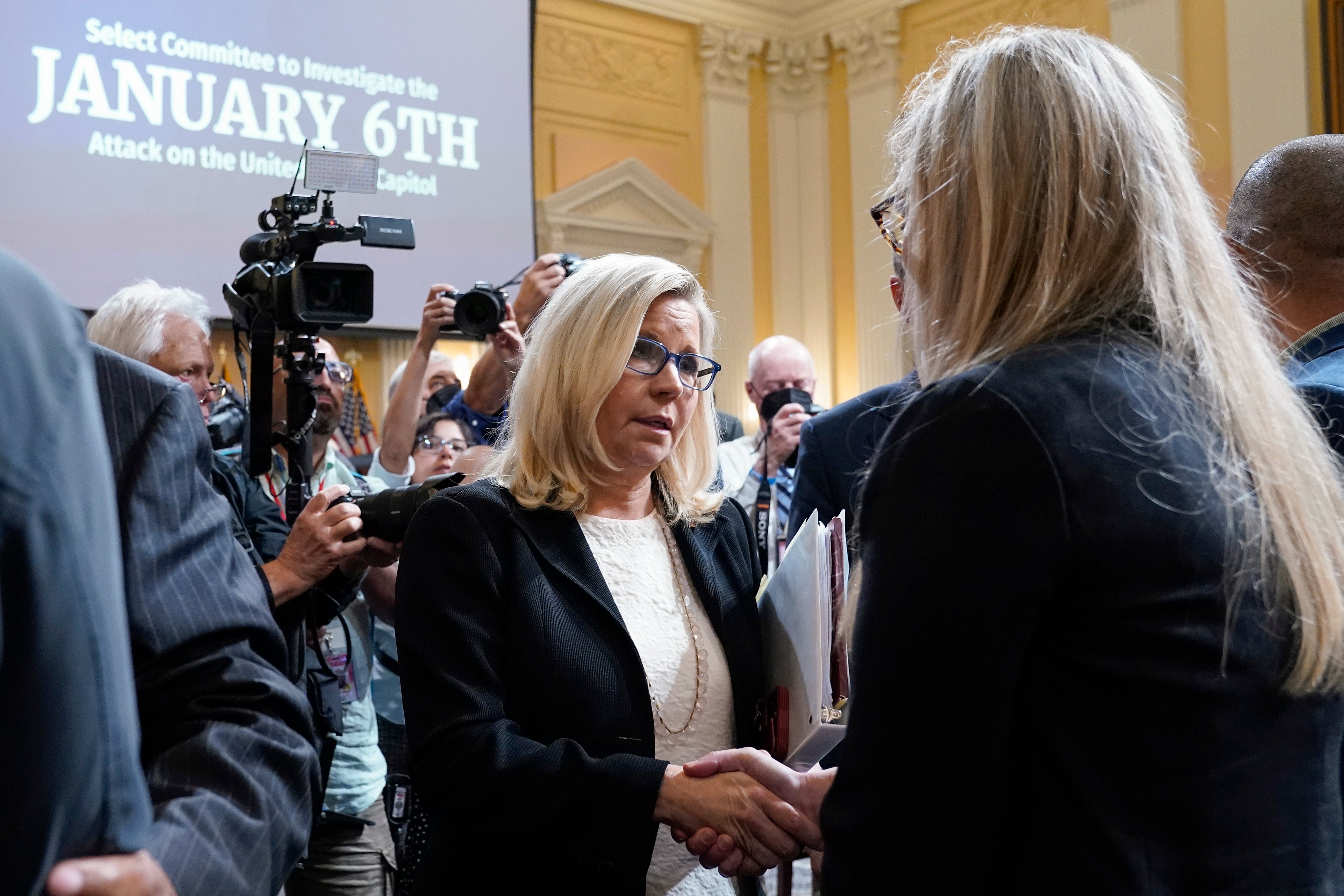 Vice chair Rep. Liz Cheney, R-Wyo., greets Erin Smith, widow of U.S. Capitol Police officer Jeffrey Smith, as the House select committee investigates the Jan. 6 attack on the U.S. Capitol