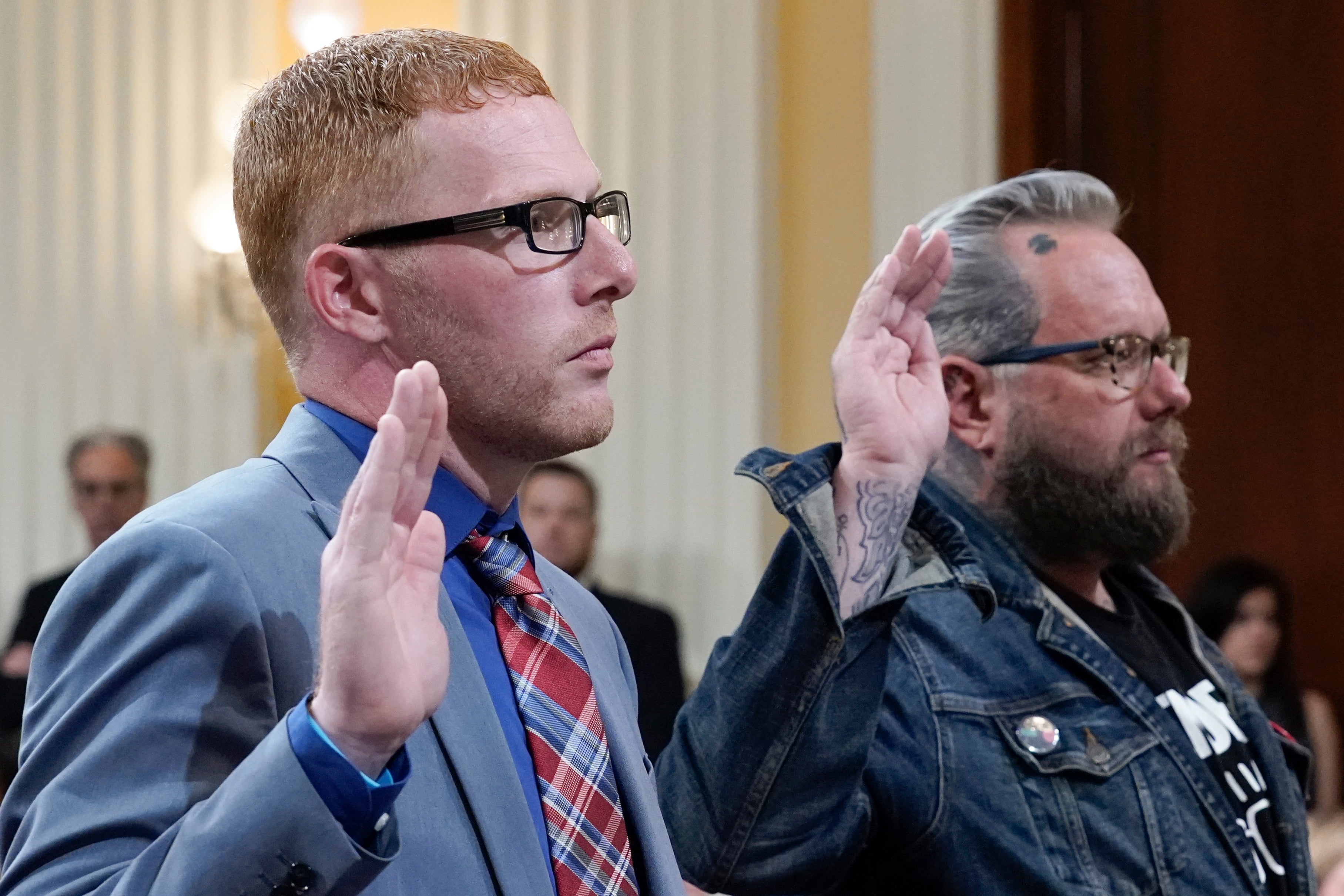 Stephen Ayres, who pleaded guilty in June 2022 to disorderly and disruptive conduct in a restricted building, left, and Jason Van Tatenhove, an ally of Oath Keepers leader Stewart Rhodes, right, are sworn in to testify as the House