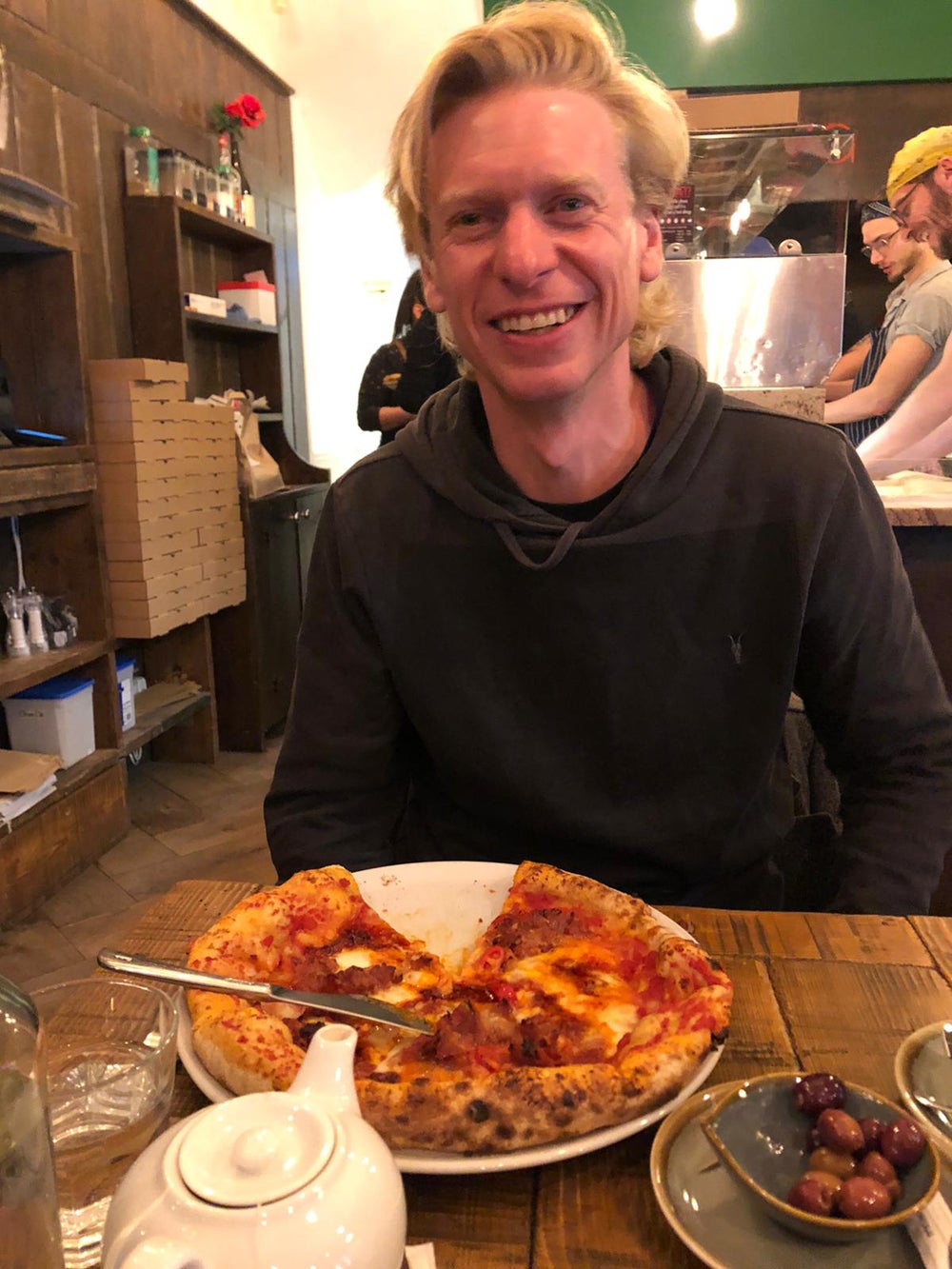 Gavin eating a pizza on a night out (Collect/PA Real Life)