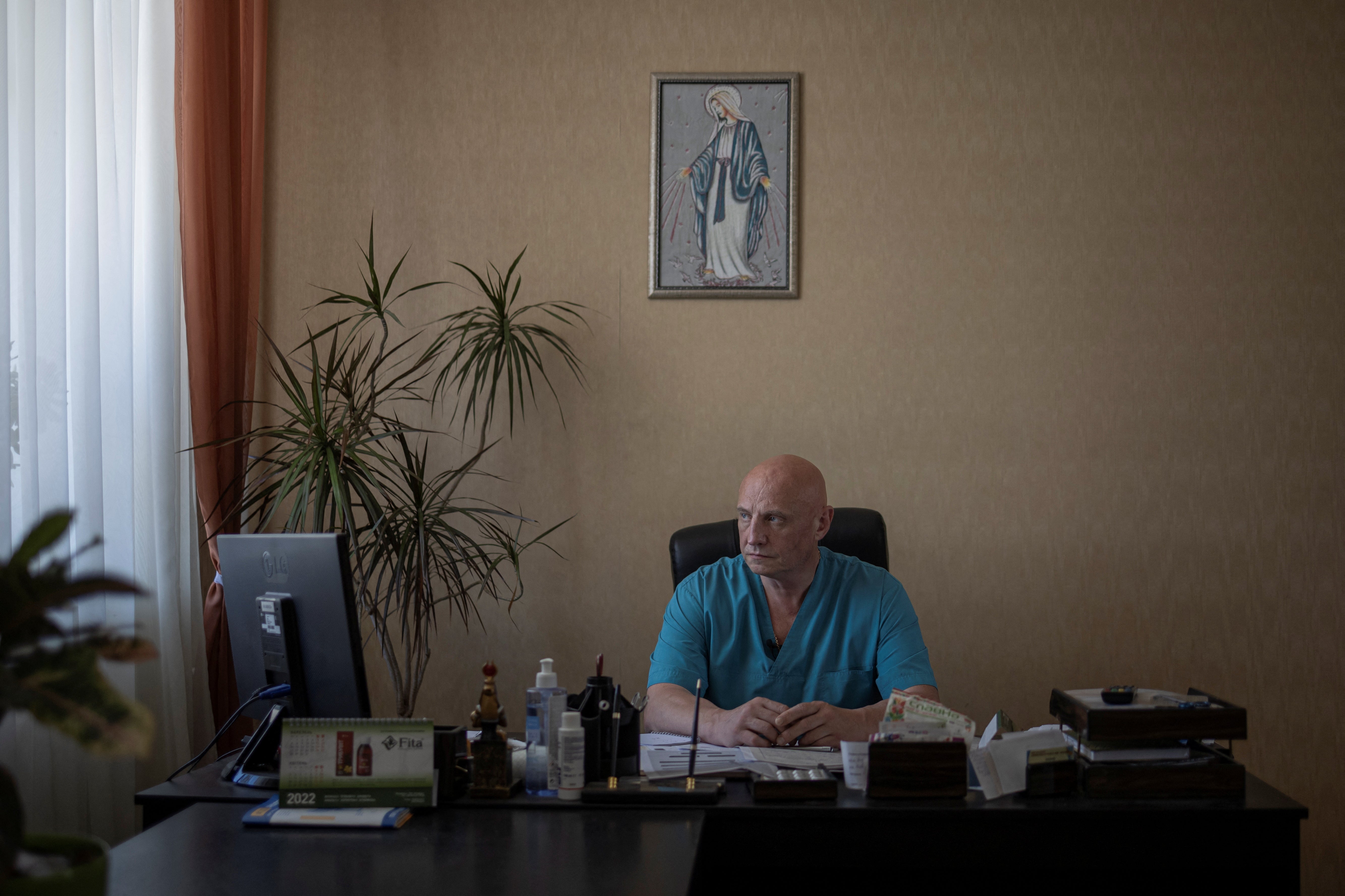 Dr Ivan Tsyganok sits at his desk inside Pokrovsk maternity hospital