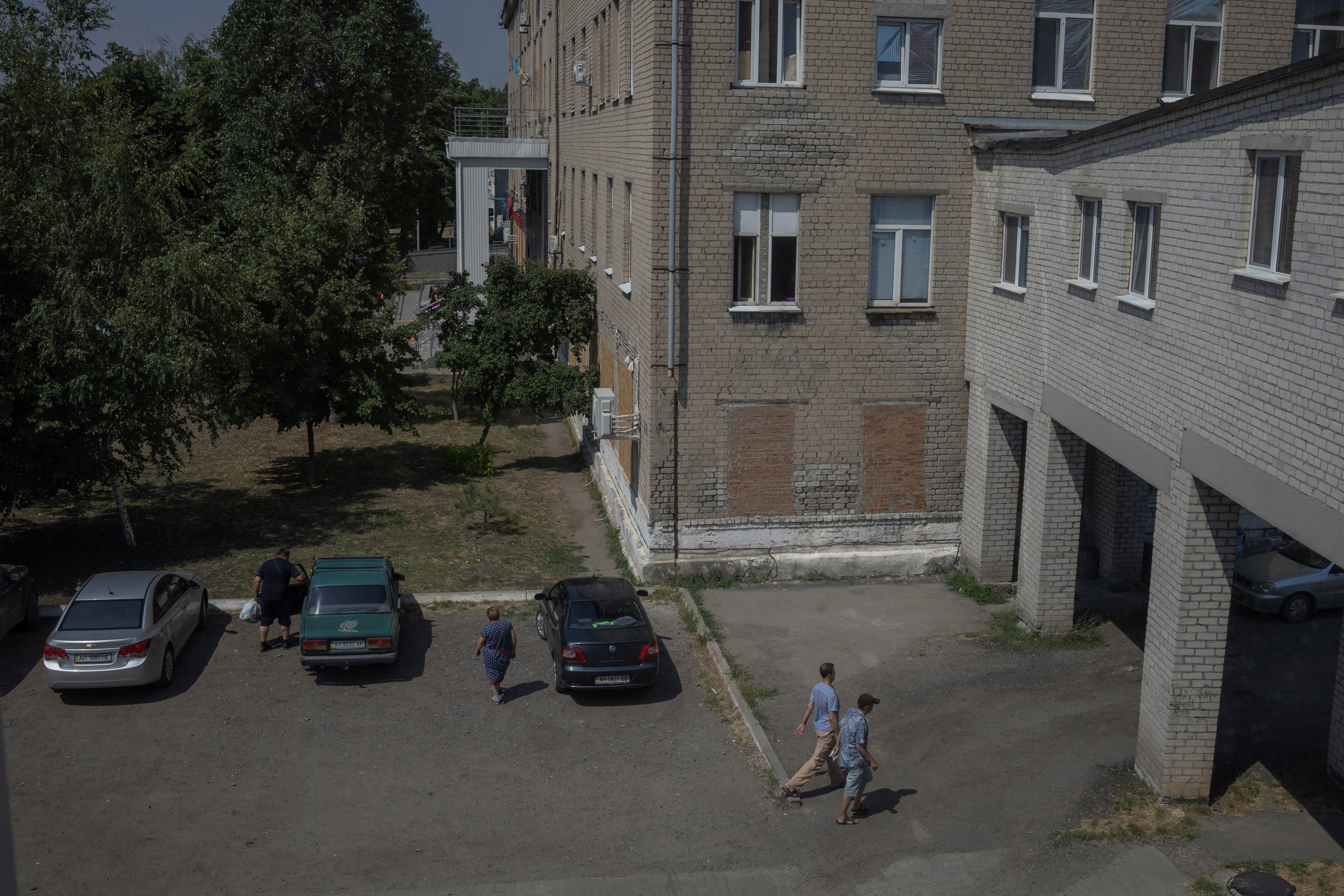 People walk in front of Pokrovsk maternity hospital