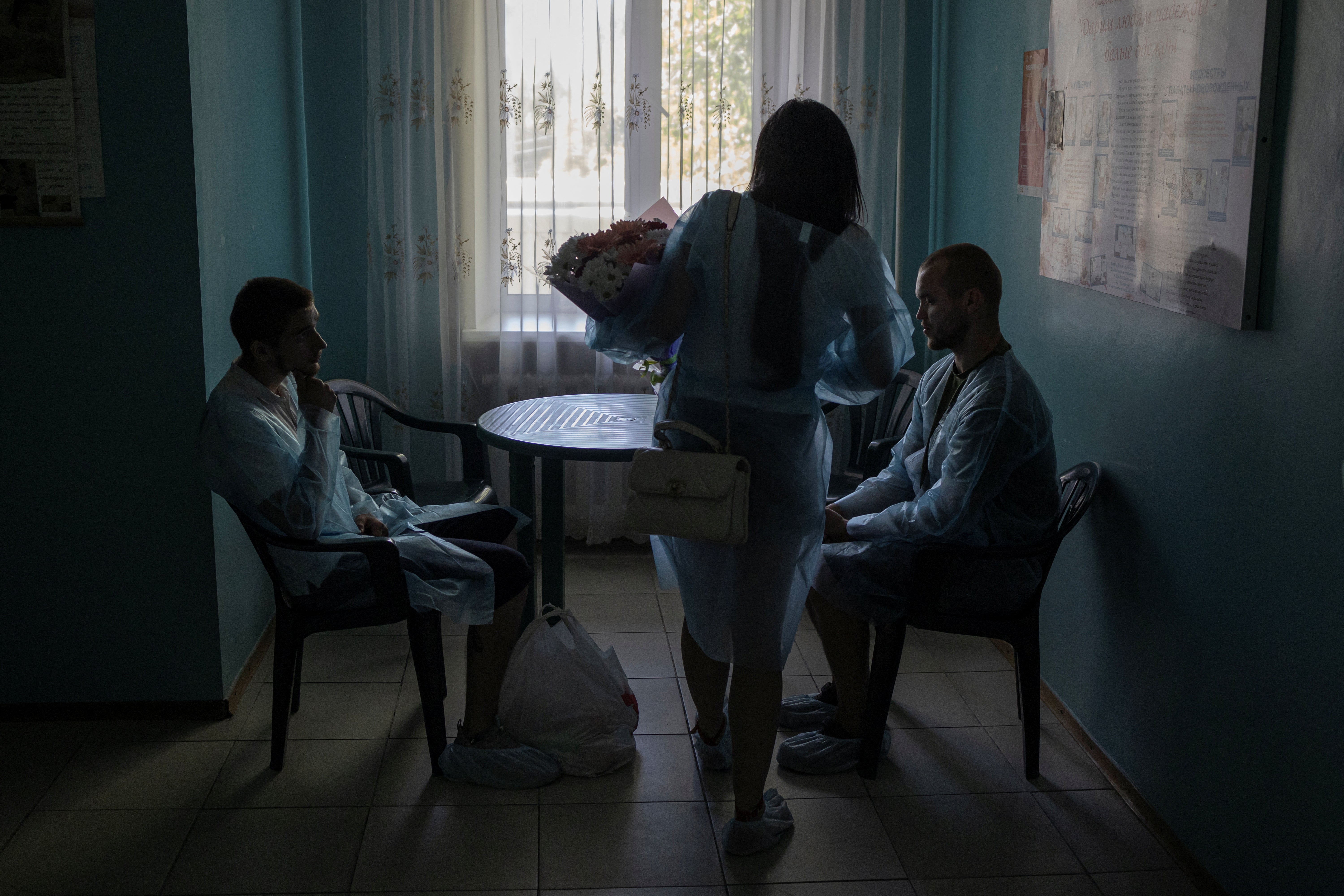 Visitors sit inside Pokrovsk maternity hospital