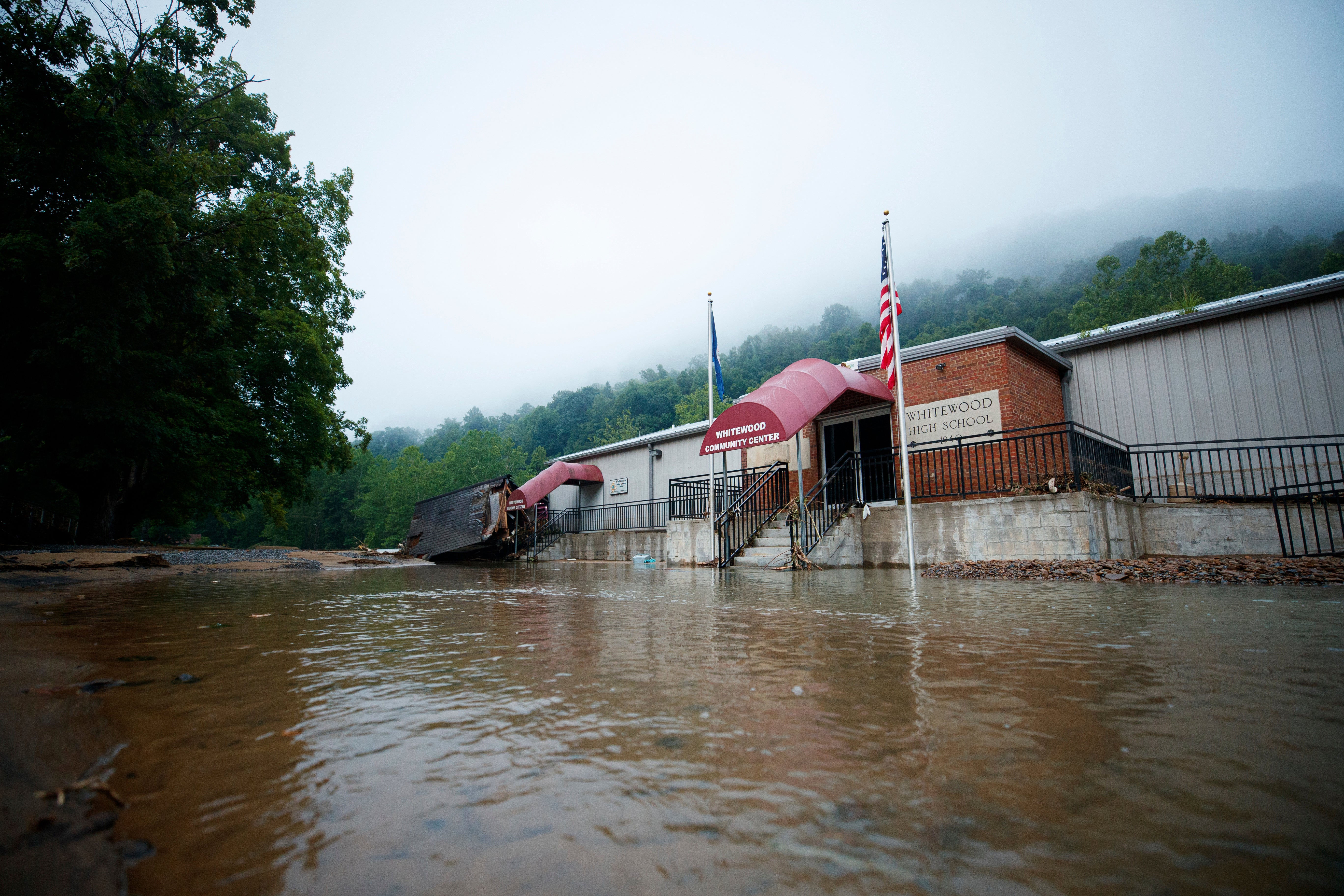 Flood waters surround the Whitewood Community Center