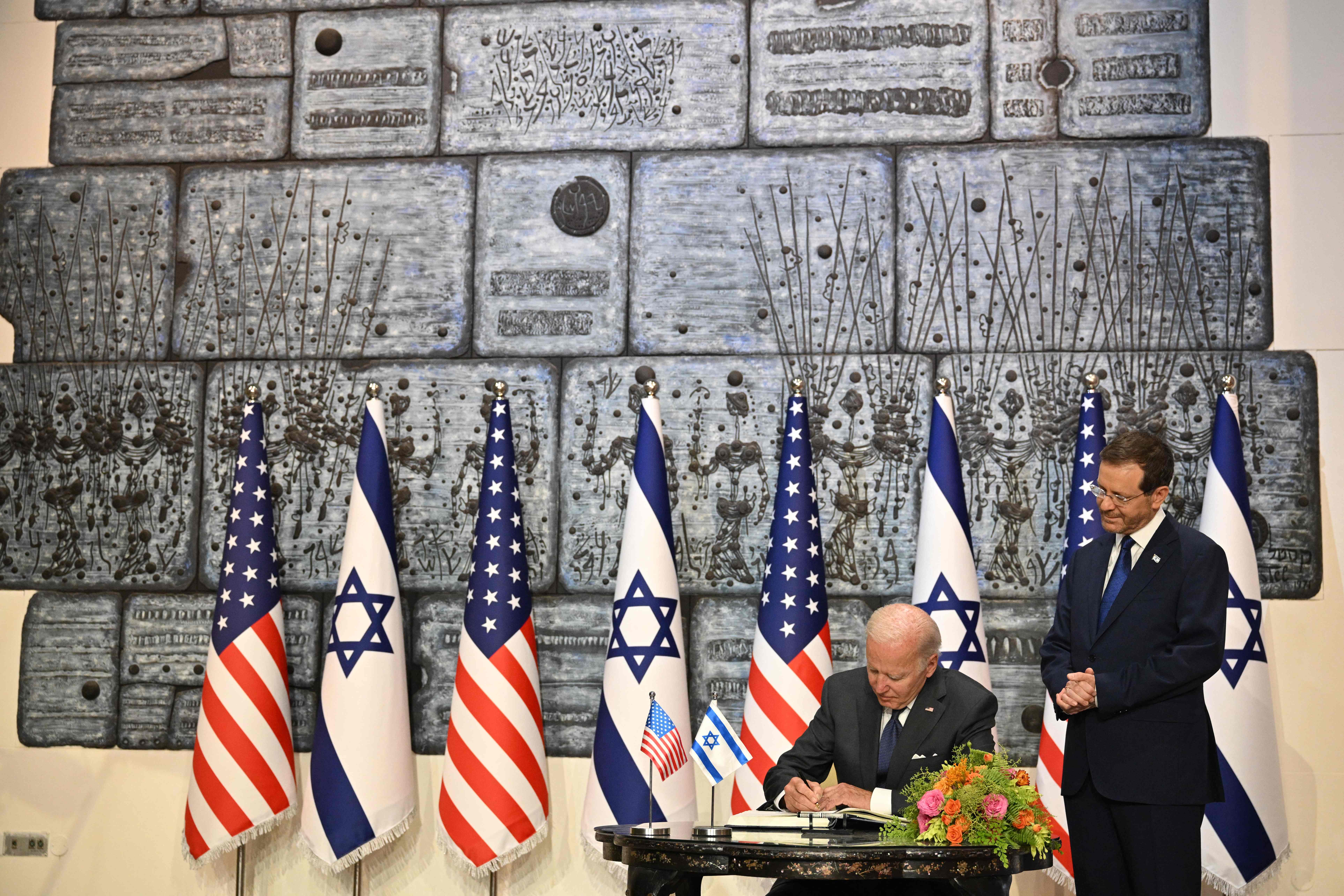 President Biden signs the guest book at the Presidential residence in Jerusalem