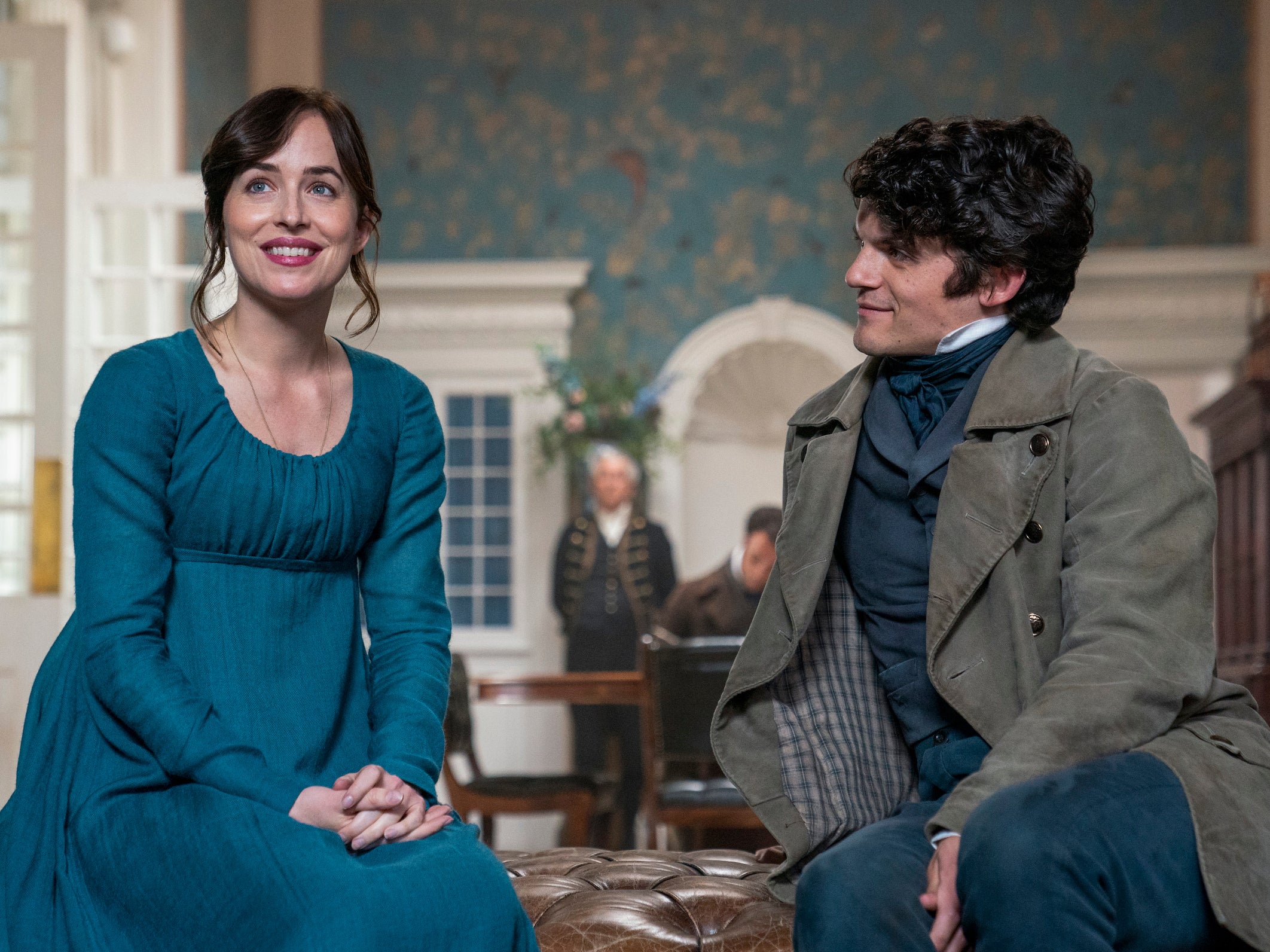 (Left to right) Dakota Johnson as Anne Elliot, Edward Bluemel as Captain Harville in Persuasion.