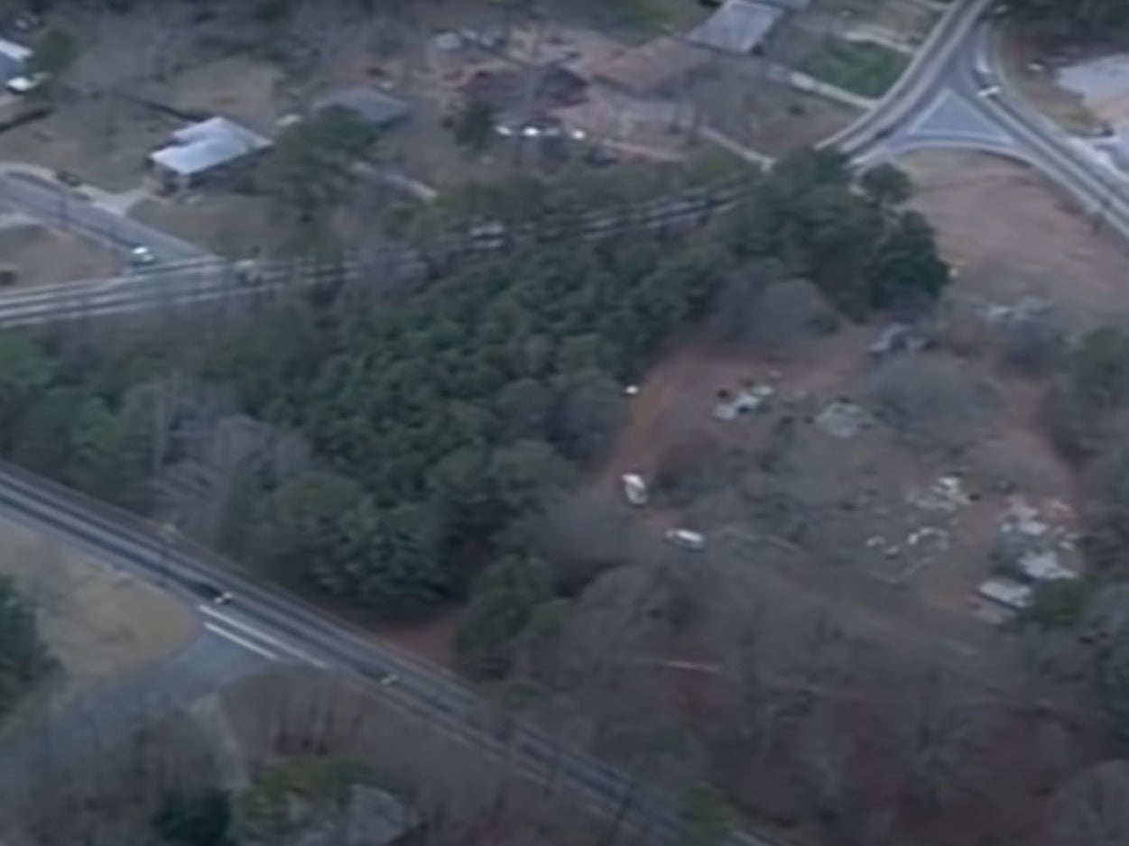 The child was found in a wooded area near a cemetery in 1999