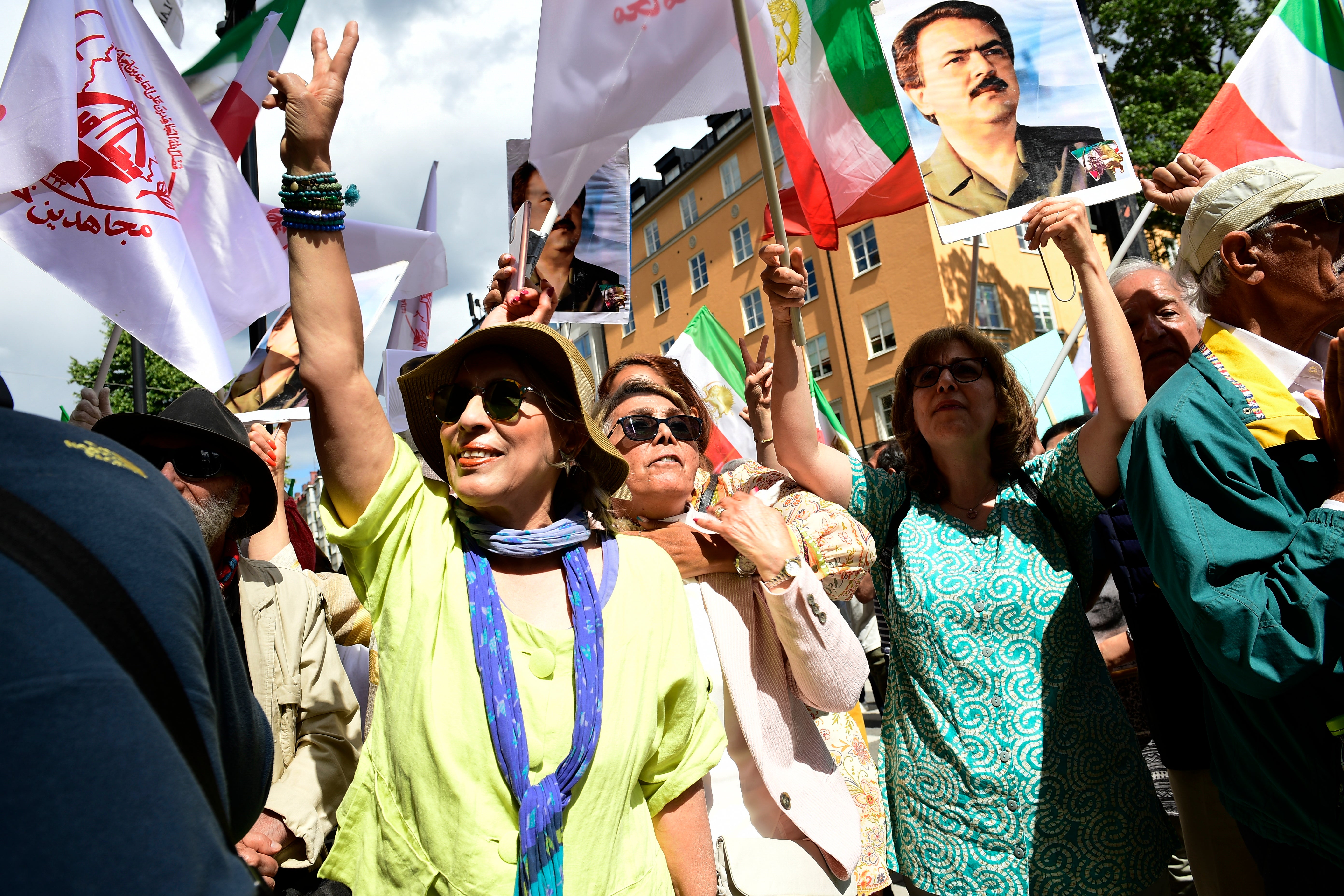 People react outside the Stockholm District Court, where the verdict was announced