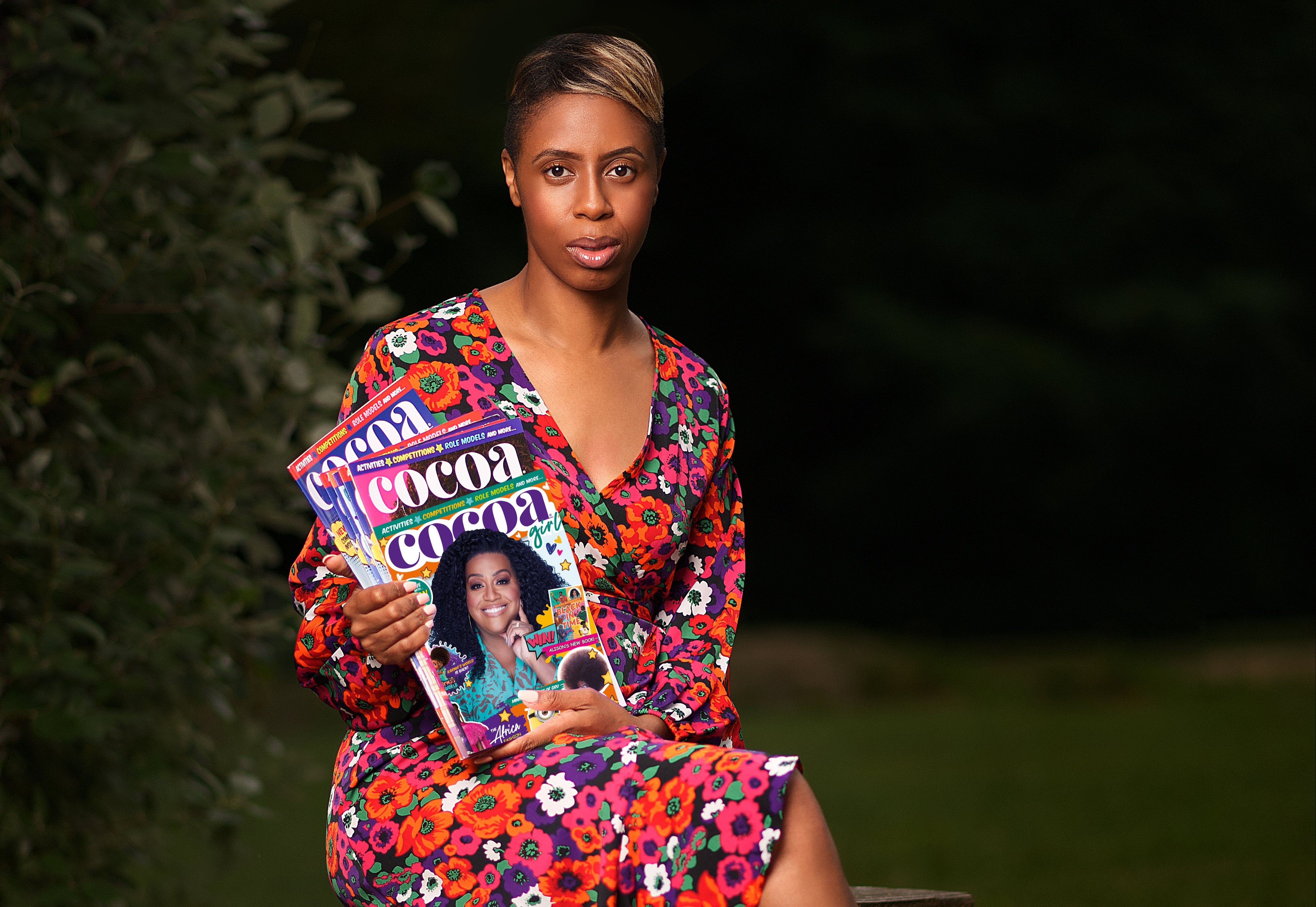 Boyd holding July’s issues of ‘Cocoa Girl’ and ‘Cocoa Boy’ magazine