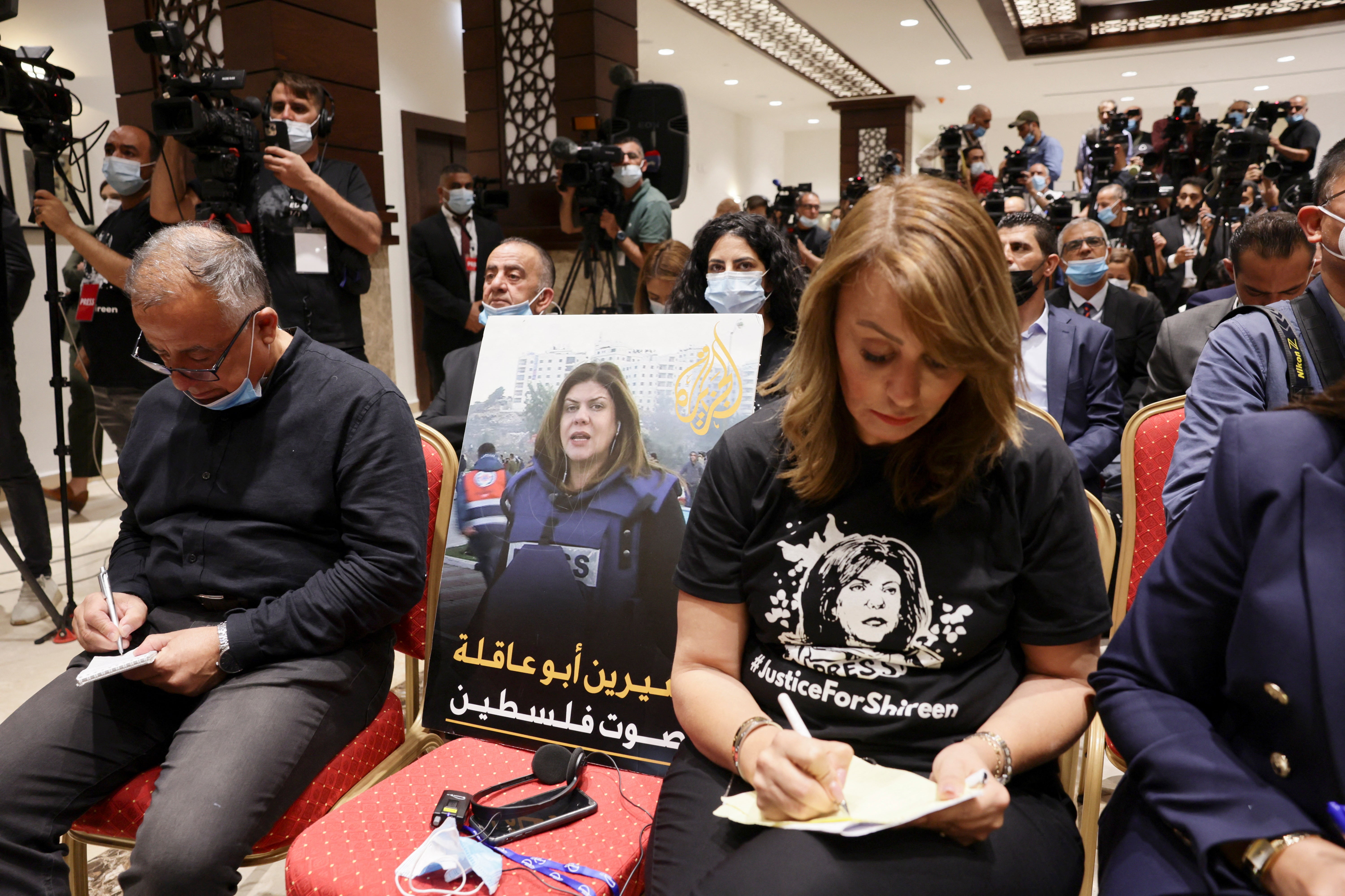 An image of slain Palestinian-American journalist Shireen Abu Akleh is placed on a chair at the leaders’ joint news conference