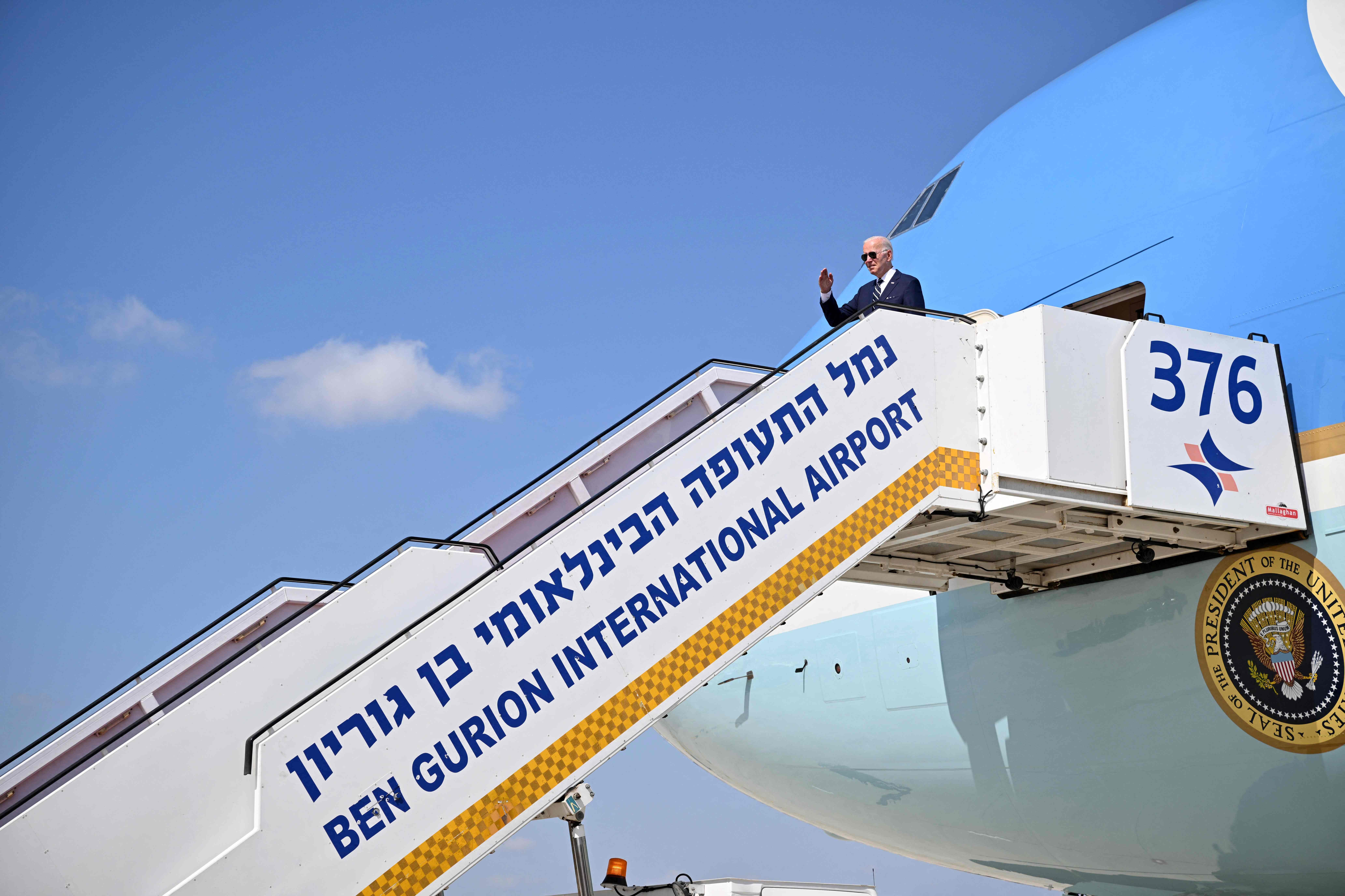 Joe Biden gives a salute before boarding Air Force One to depart Israel’s Ben Gurion Airport on 15 July 2022