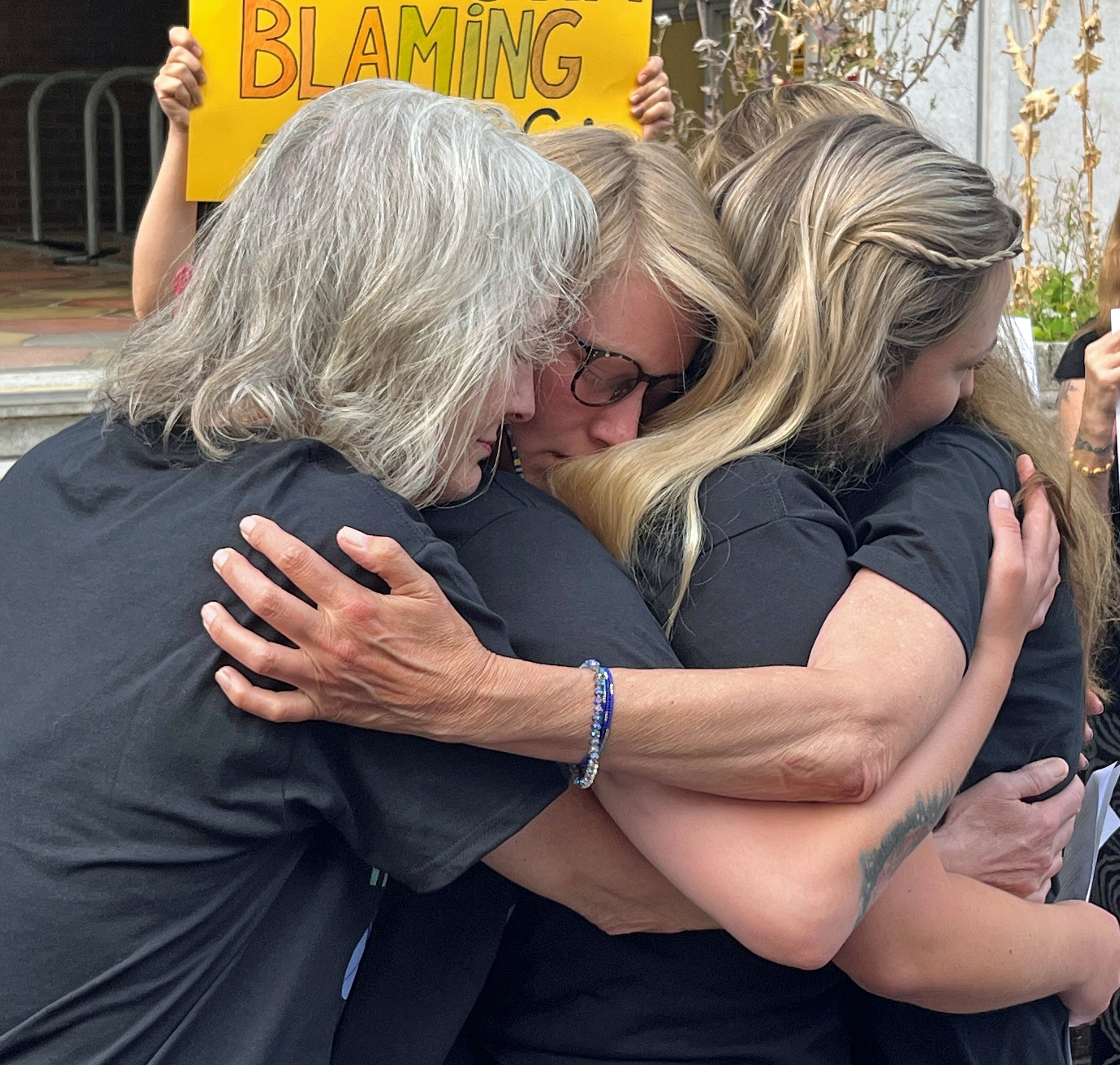 Gaia Pope-Sutherland’s family comfort each other outside Dorset coroner’s court