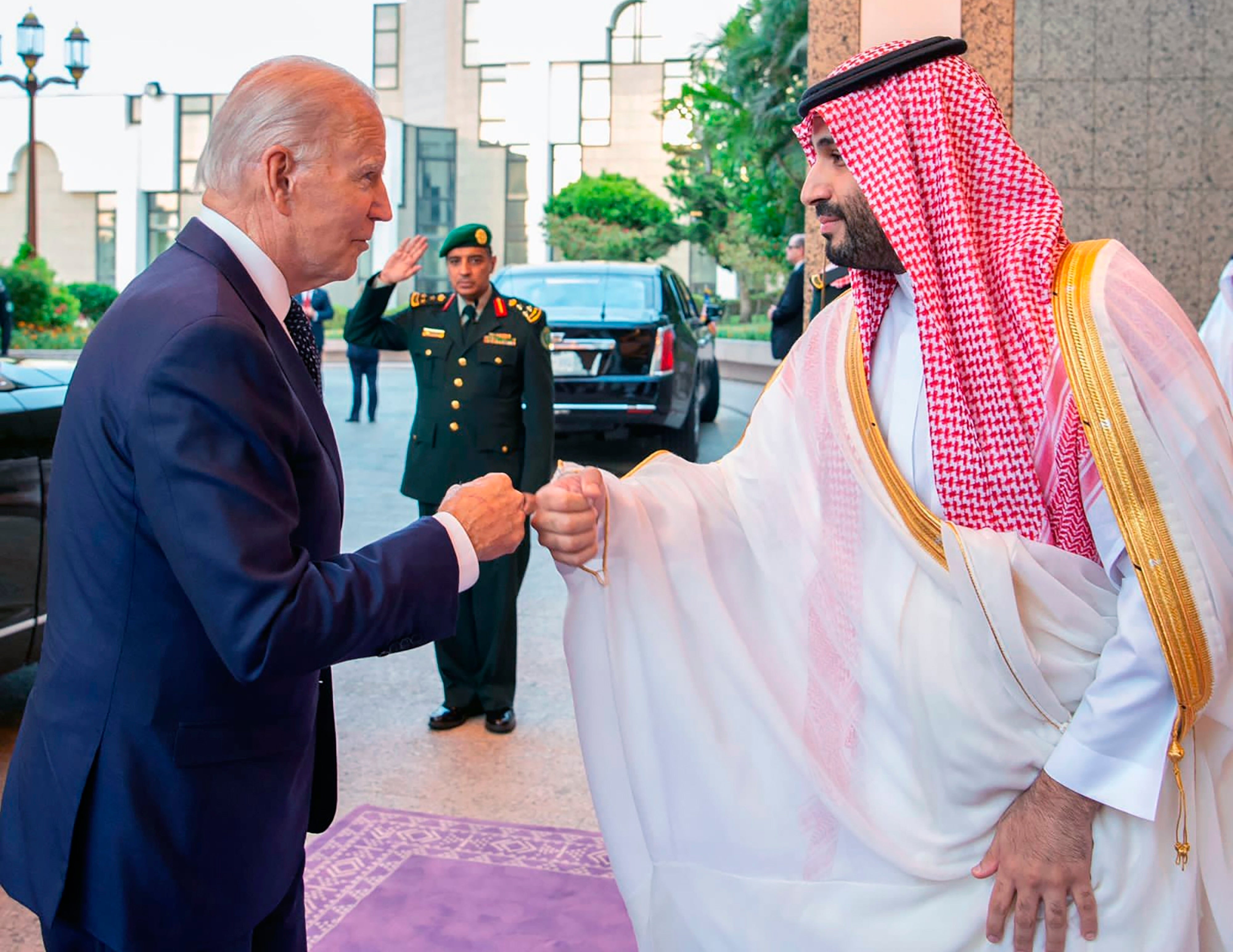 President Joe Biden greets MBS with a fist bump.