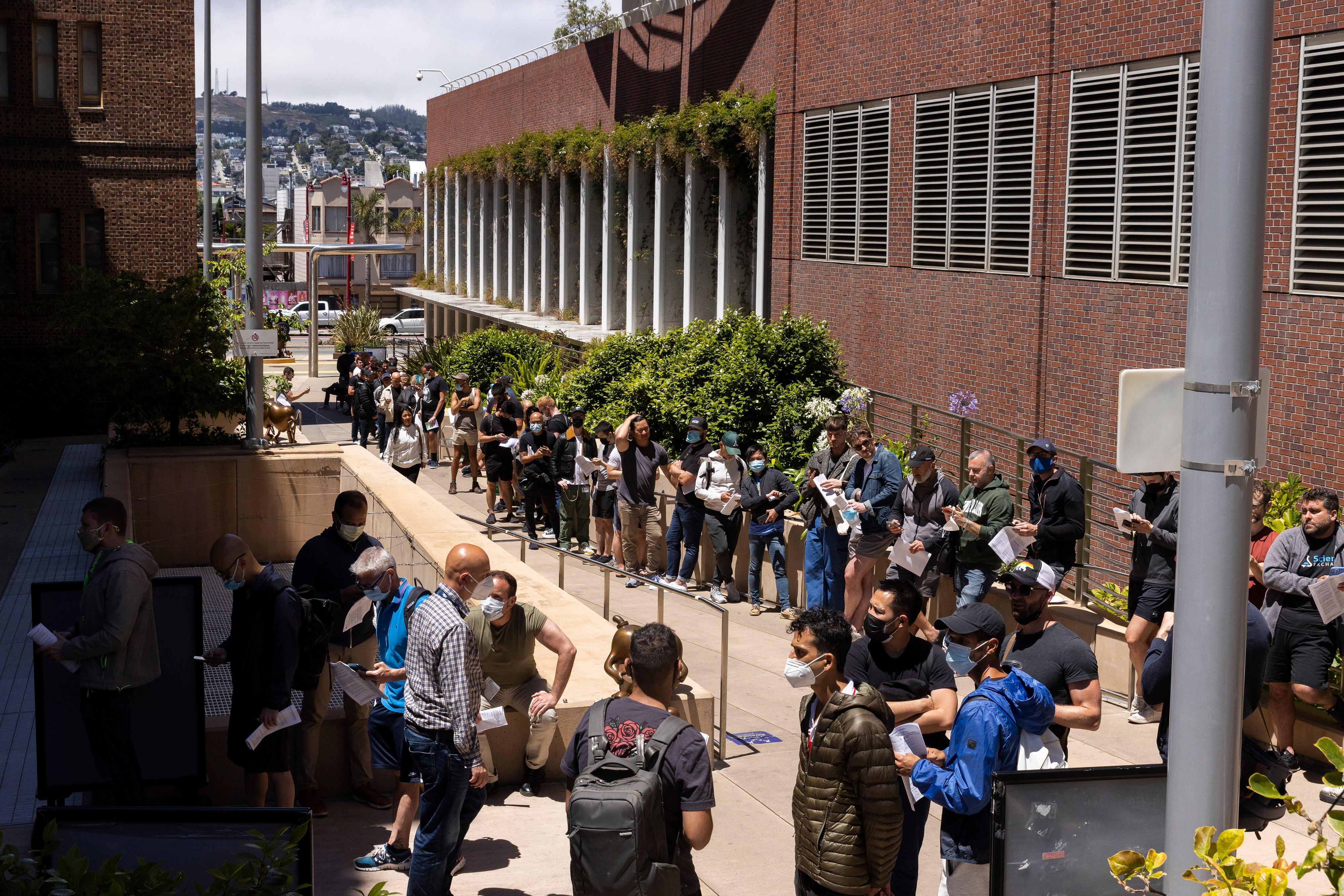 People stand in long lines to receive the monkeypox vaccine at San Francisco General Hospital on 12 July