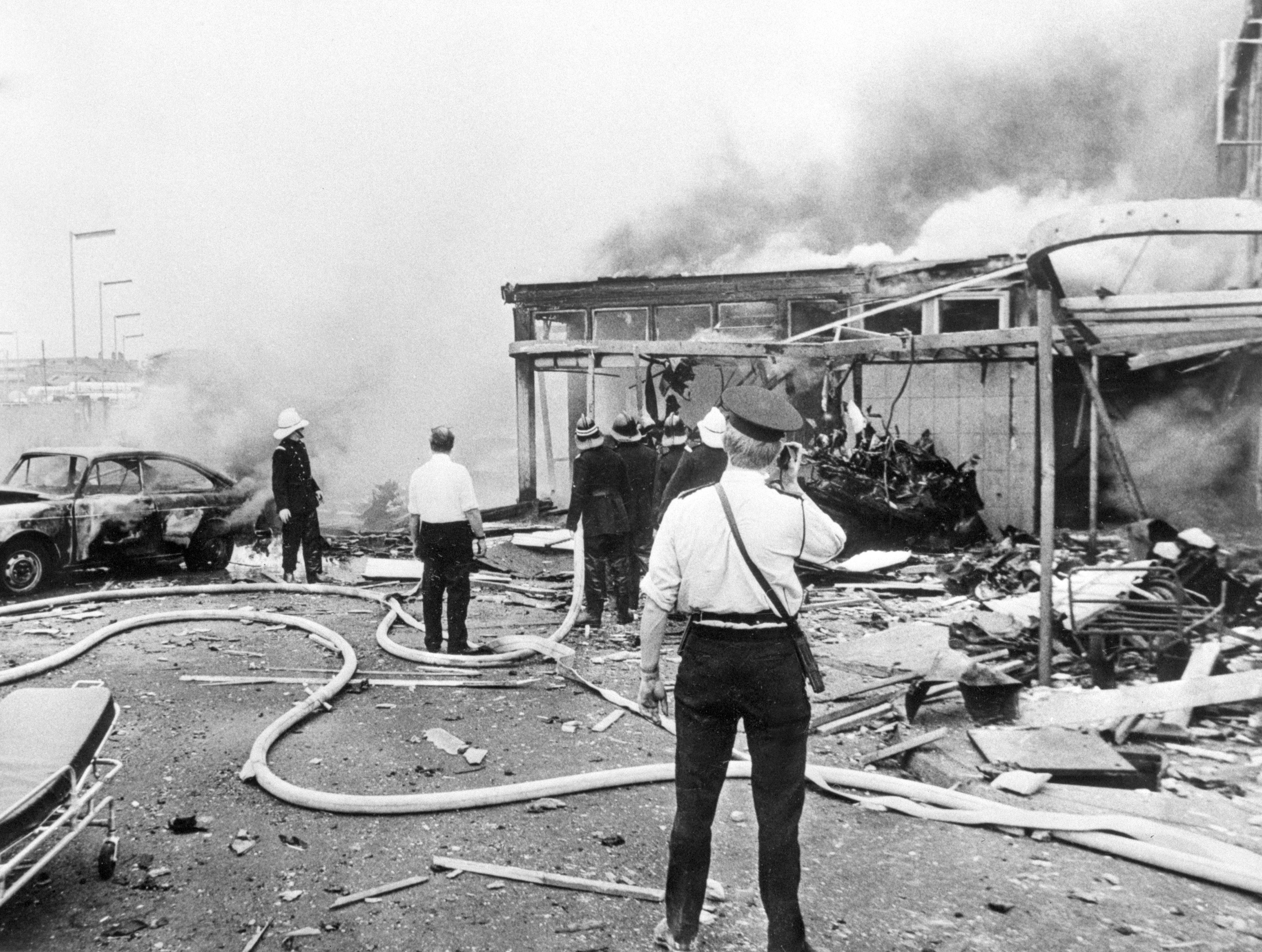 Emergency workers attend the scene at Oxford Street bus station in Belfast following a bomb which was part of a series which became known as Bloody Friday (PA Archive)