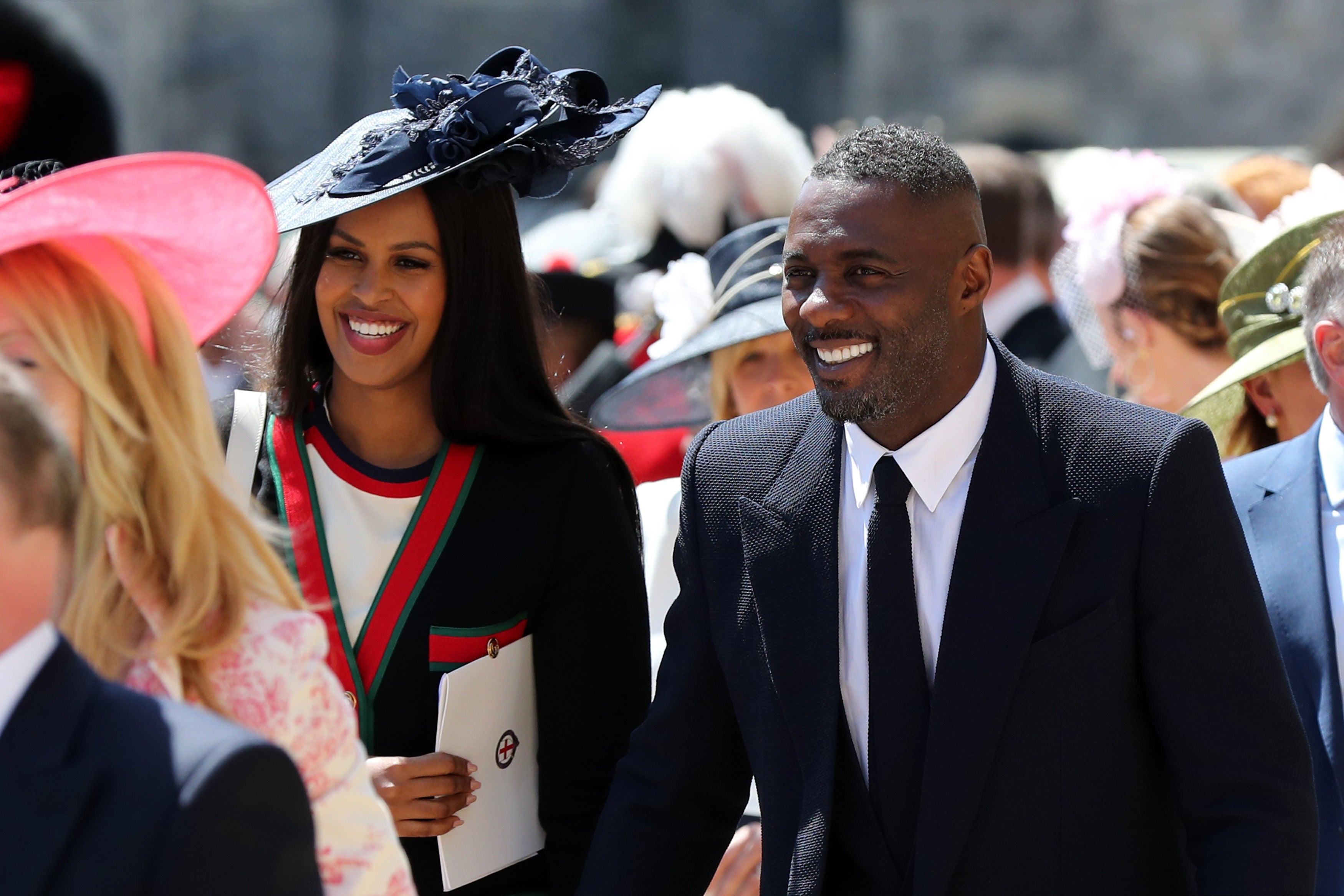 Sabrina Dhowre and Idris Elba leaves St George's Chapel at Windsor Castle after the wedding of Meghan Markle and Prince Harry on May 19, 2018