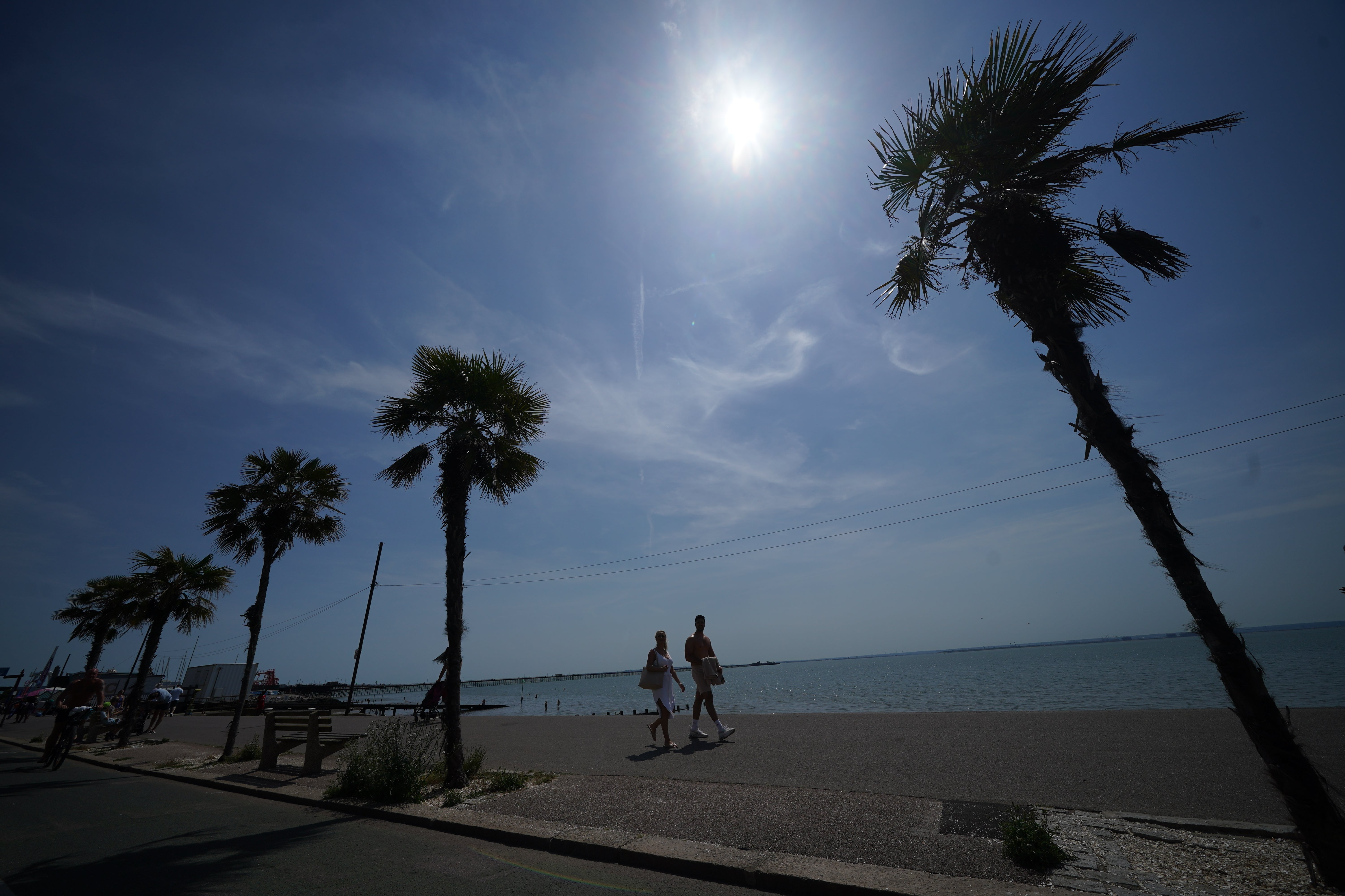 People walk along the promenade at Southend-on-Sea on the Thames Estuary in Essex (Yui Mok/PA)