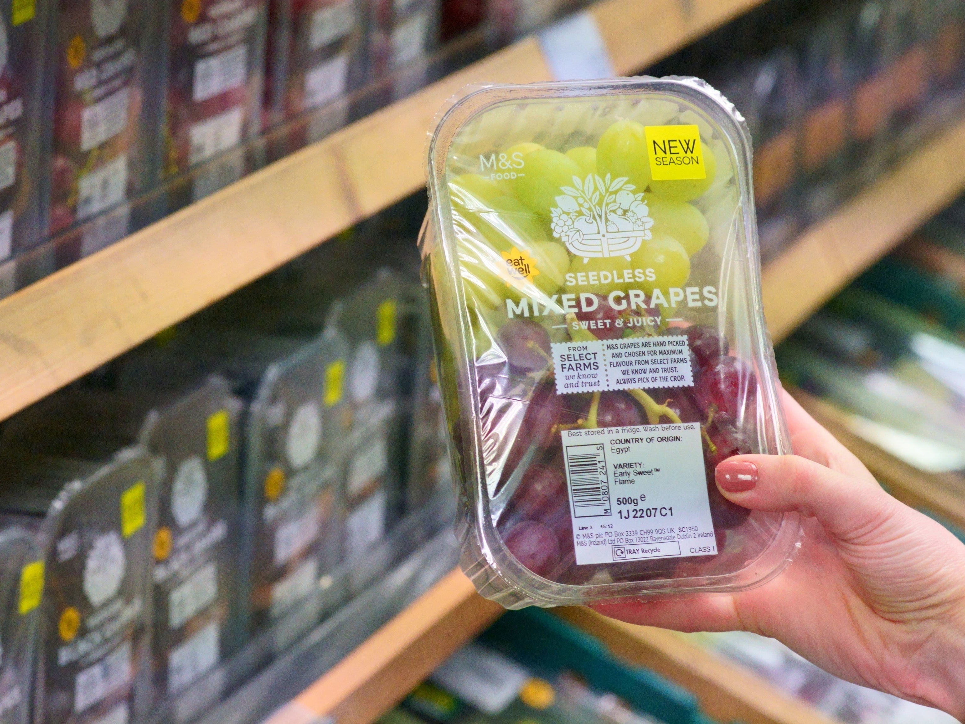 A tub of grapes from Marks and Spencer with the best before date removed. Marks and Spencer will remove best before dates from more than 300 fruit and vegetable products in a bid to reduce food waste