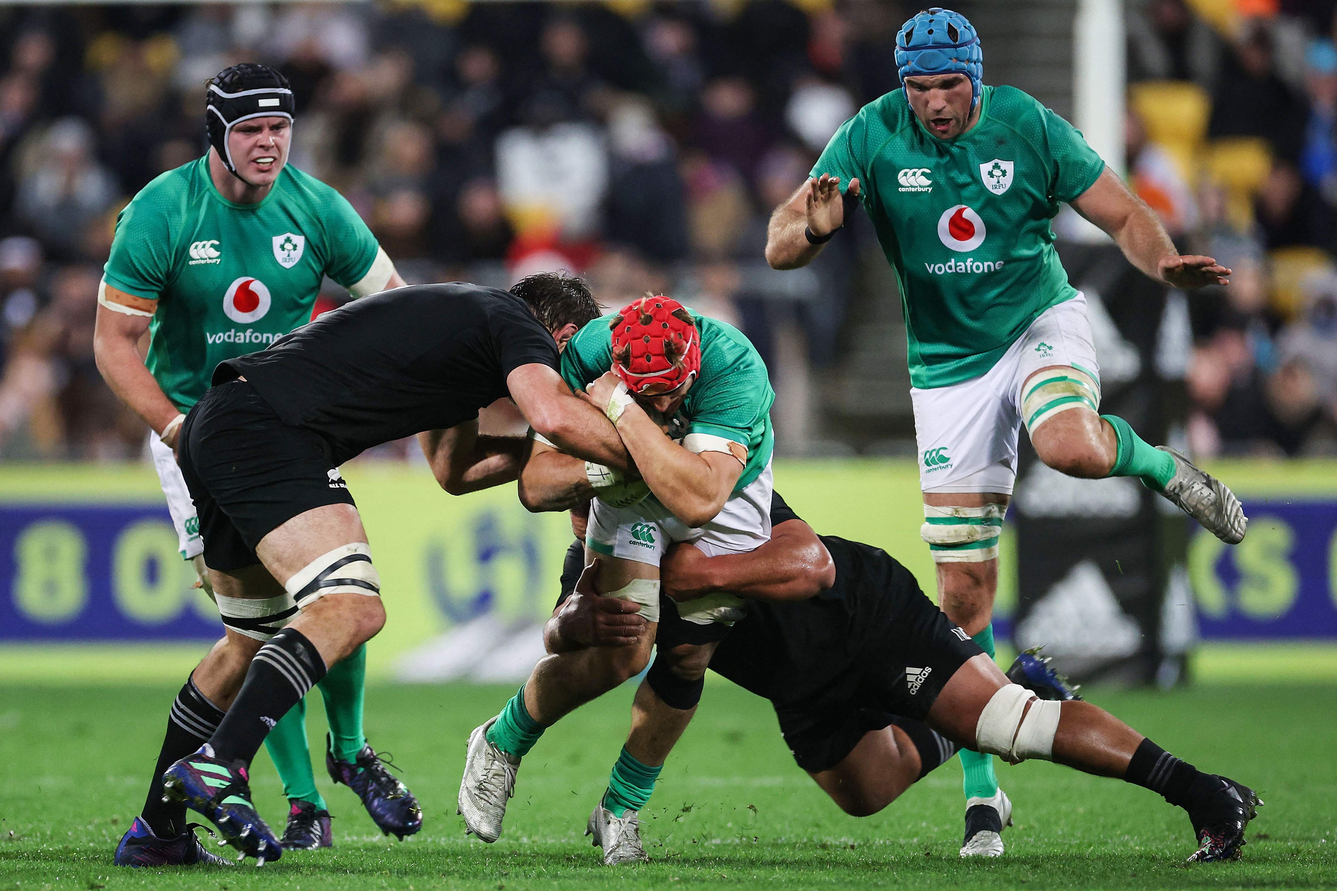 Ireland’s Josh van der Flier is tackled by the All Blacks