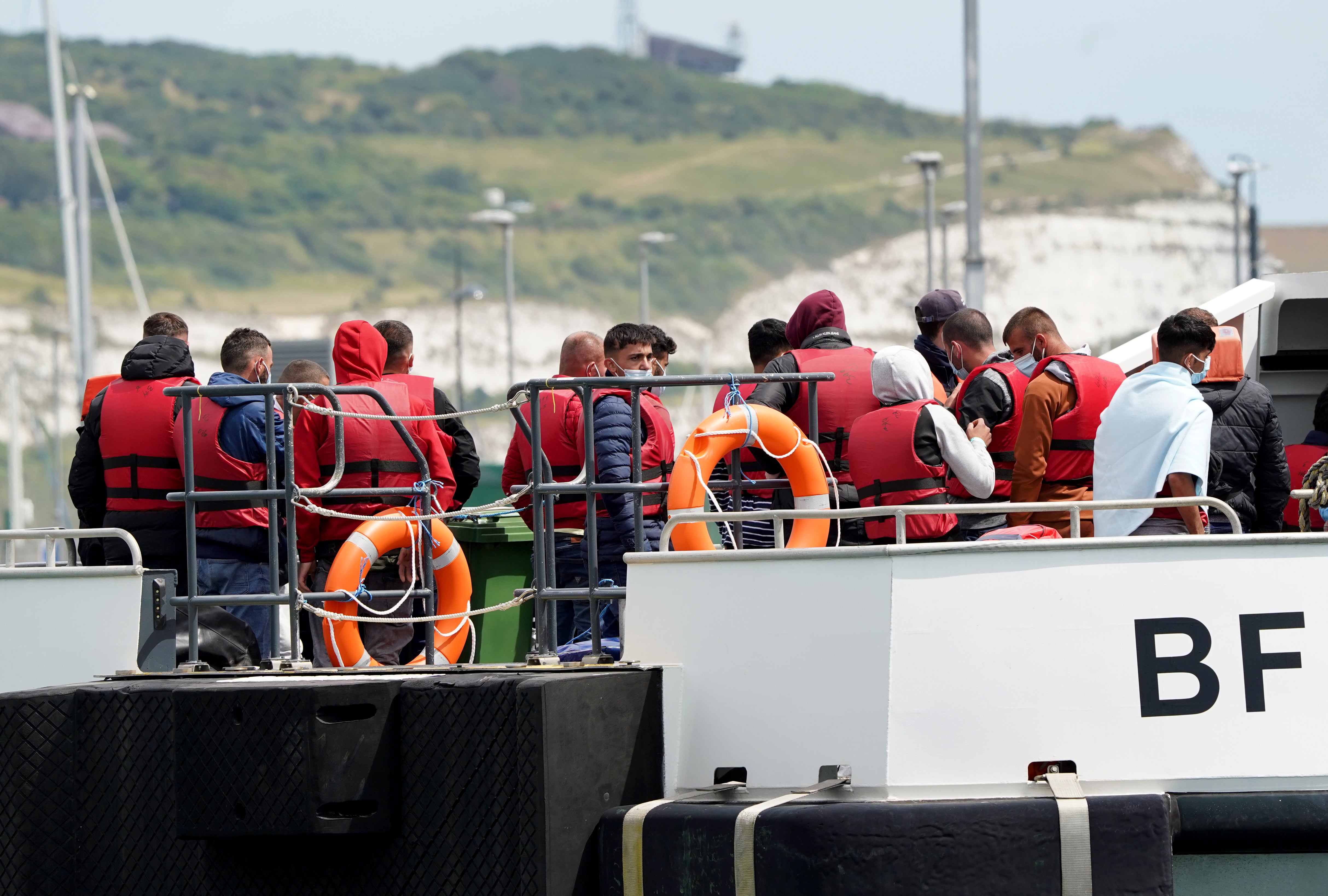 A group of people thought to be migrants are brought in to Dover, Kent, following a small boat incident in the Channel. Picture date: Thursday July 14, 2022. (Gareth Fuller/PA)