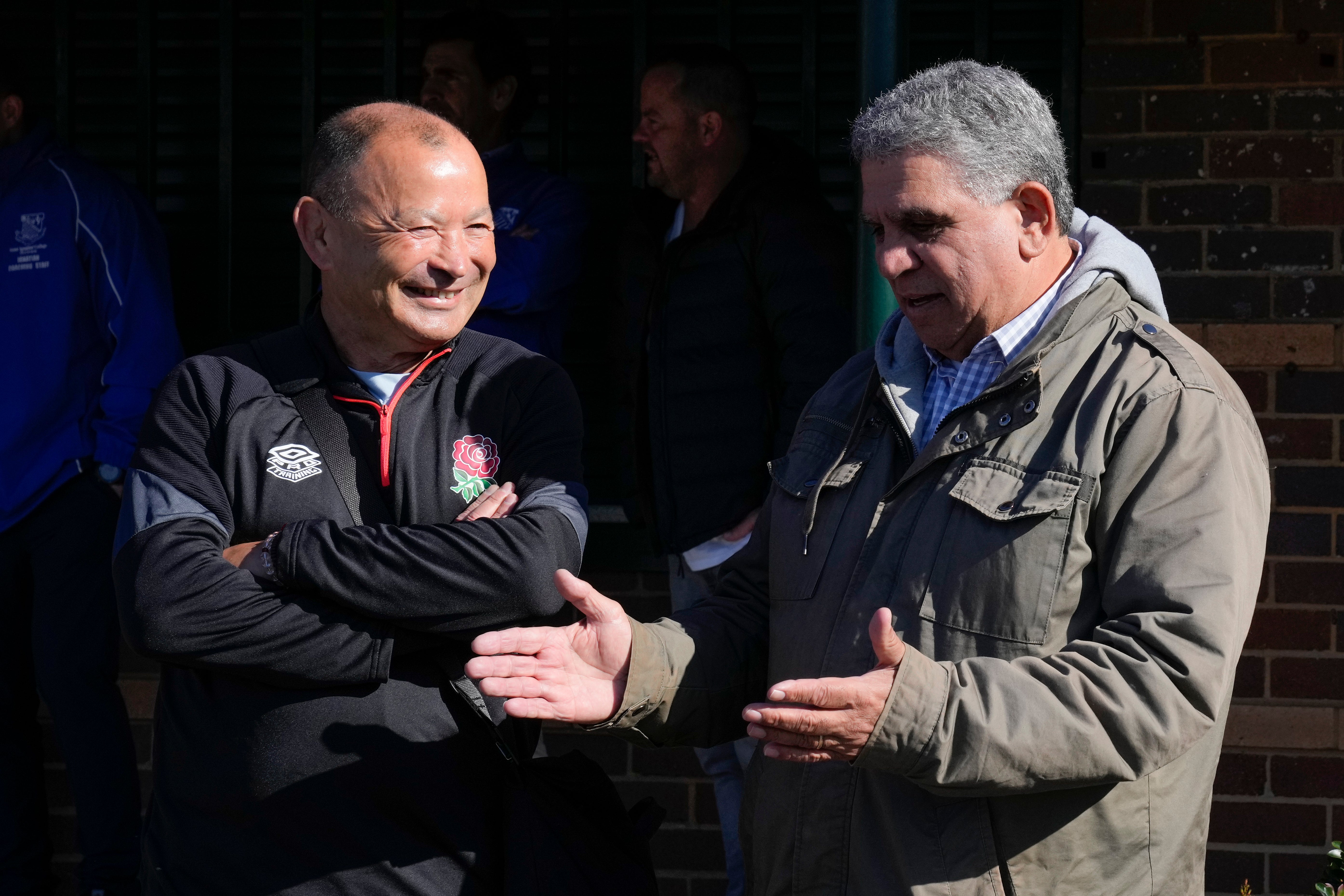 England coach Eddie Jones, left, talks with former Australian rugby player Glen Ella (Mark Baker/AP)