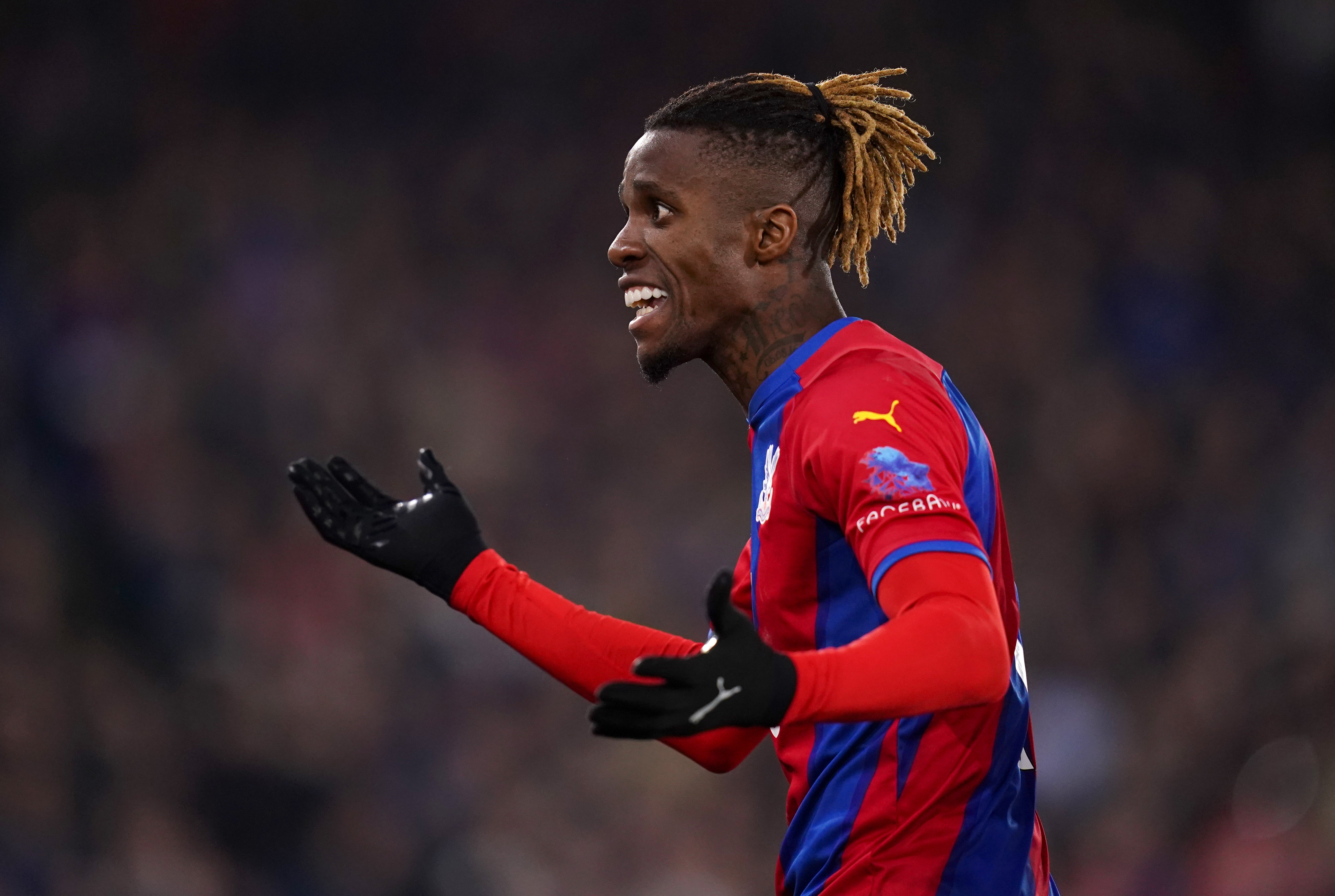 Wilfried Zaha is among Palace’s big-name absentees in Australia (John Walton/PA)