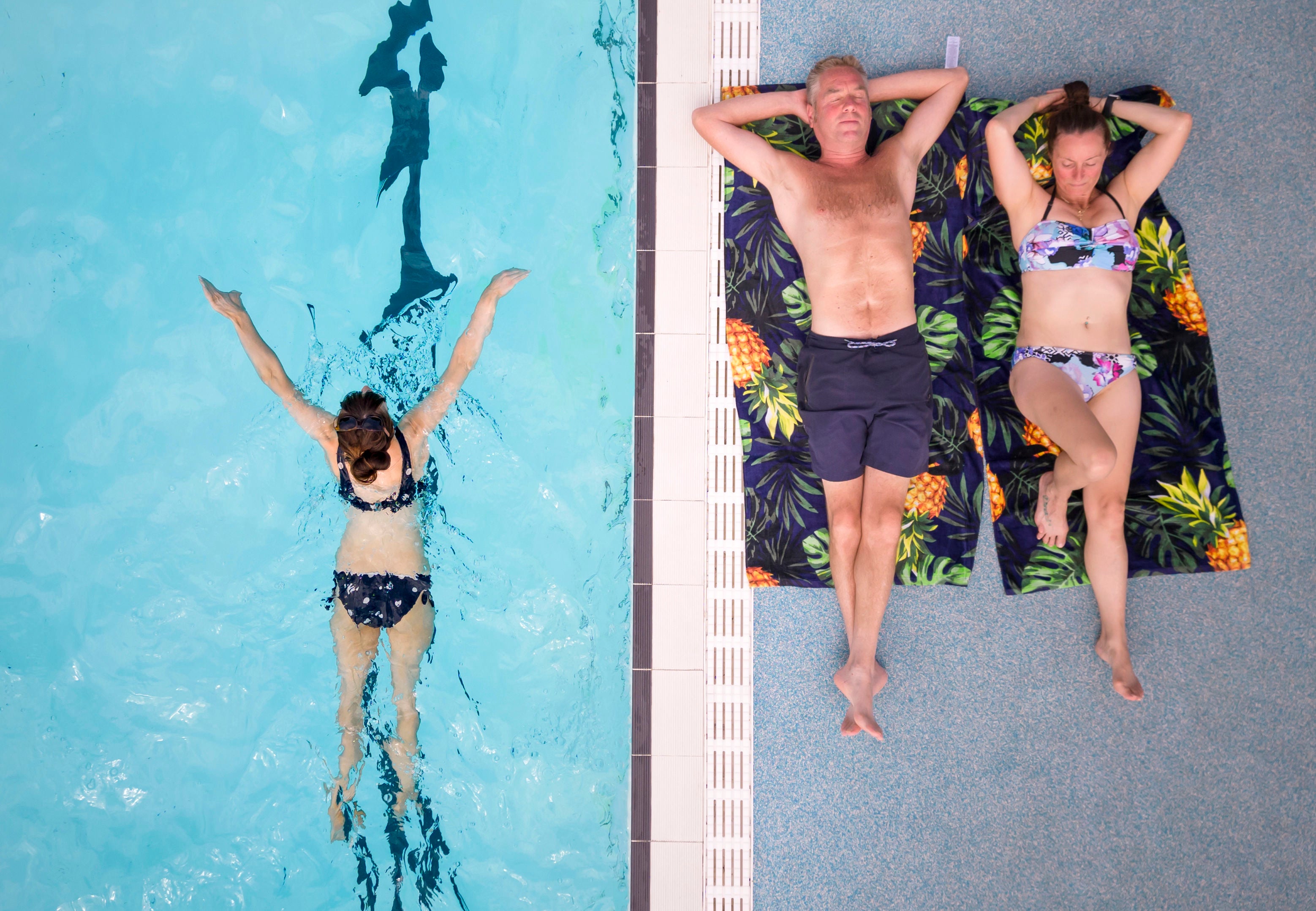 People enjoy the hot weather at Hathersage open air swimming pool at Hope Valley, near Sheffield