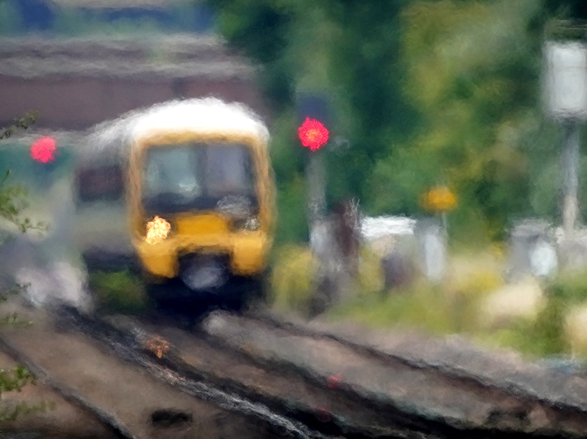 Distortion: a train passes through heat haze on a line near Ashford in Kent