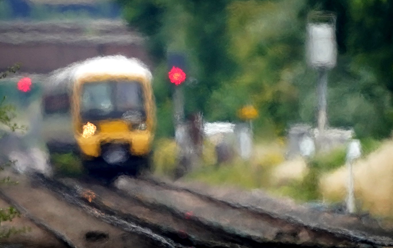 Speed restrictions imposed on trains amid fears of rails buckling in the heat could more than double journey times for passengers, the chief spokesman for Network Rail has said (Gareth Fuller/PA)