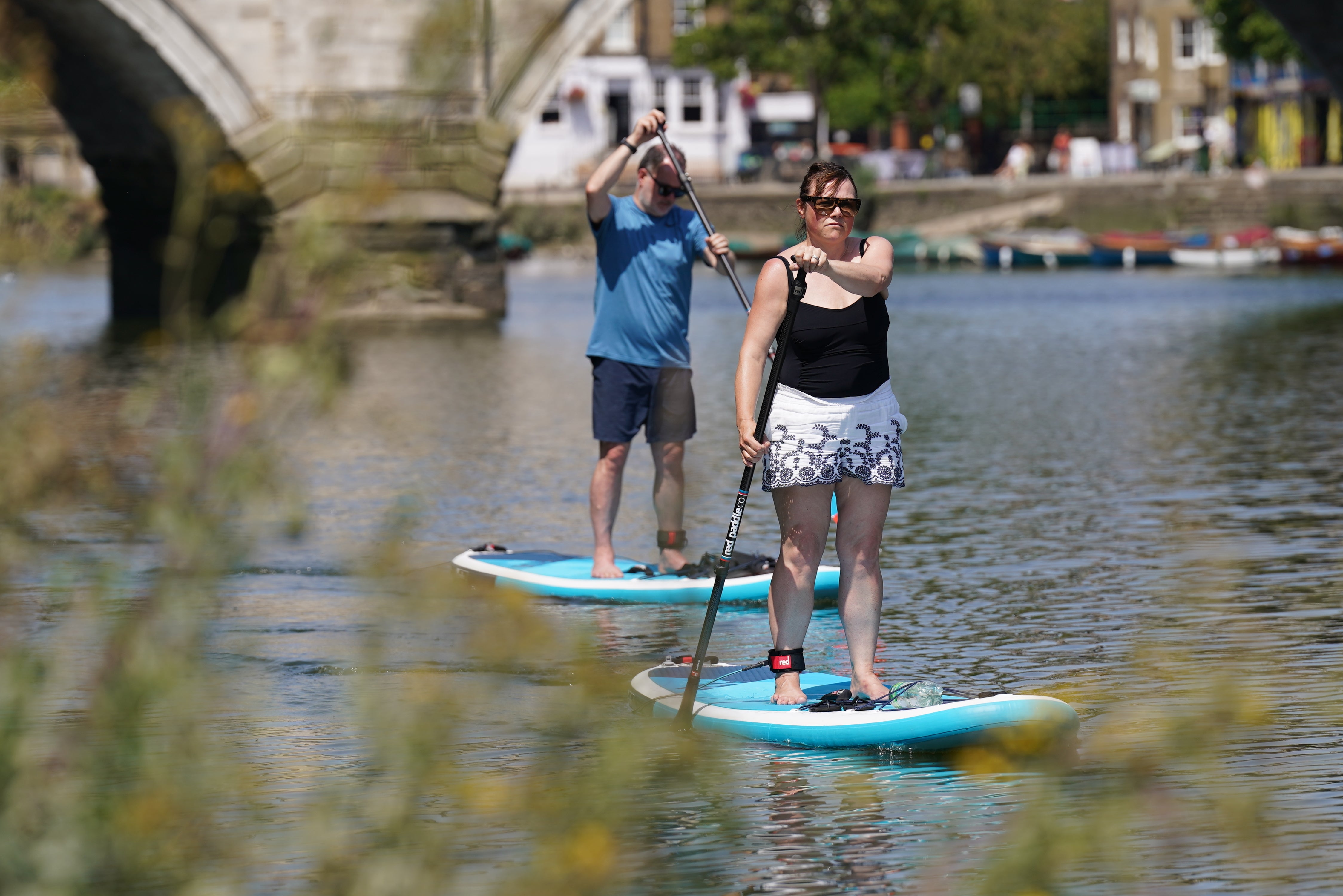 Paddleboarders on the River Thames near Richmond. The area was named as the happiest place to live