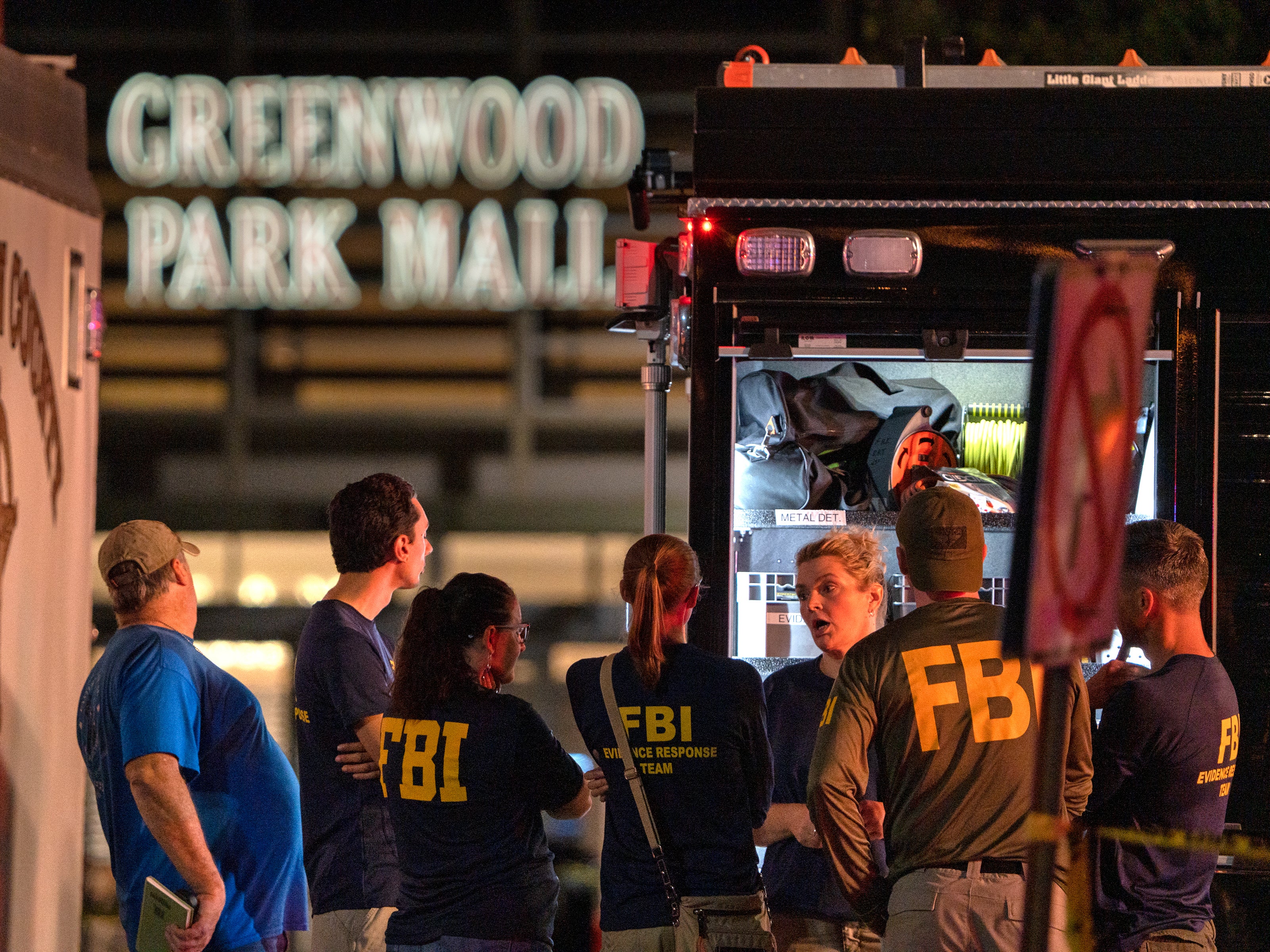 FBI agents gather at the scene of a deadly shooting, Sunday, July 17, 2022, at the Greenwood Park Mall, in Greenwood, Ind