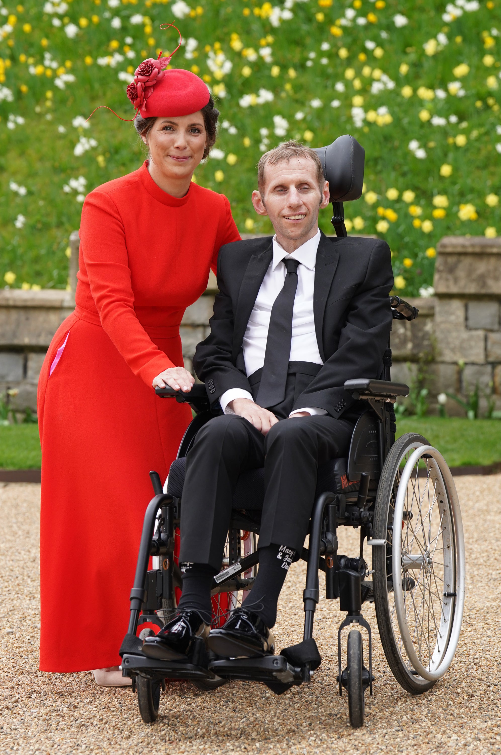 Rob Burrow and his wife Lindsey, pictured at Windsor Castle where he received his MBE, are both critical of the Government (Steve Parsons/PA)