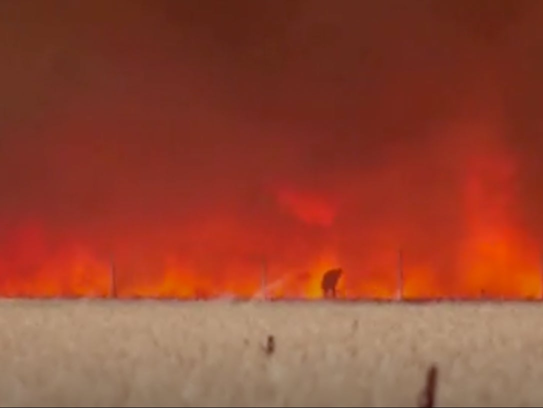 The moment in the clip that Angel Martin Arjona appears from the blaze