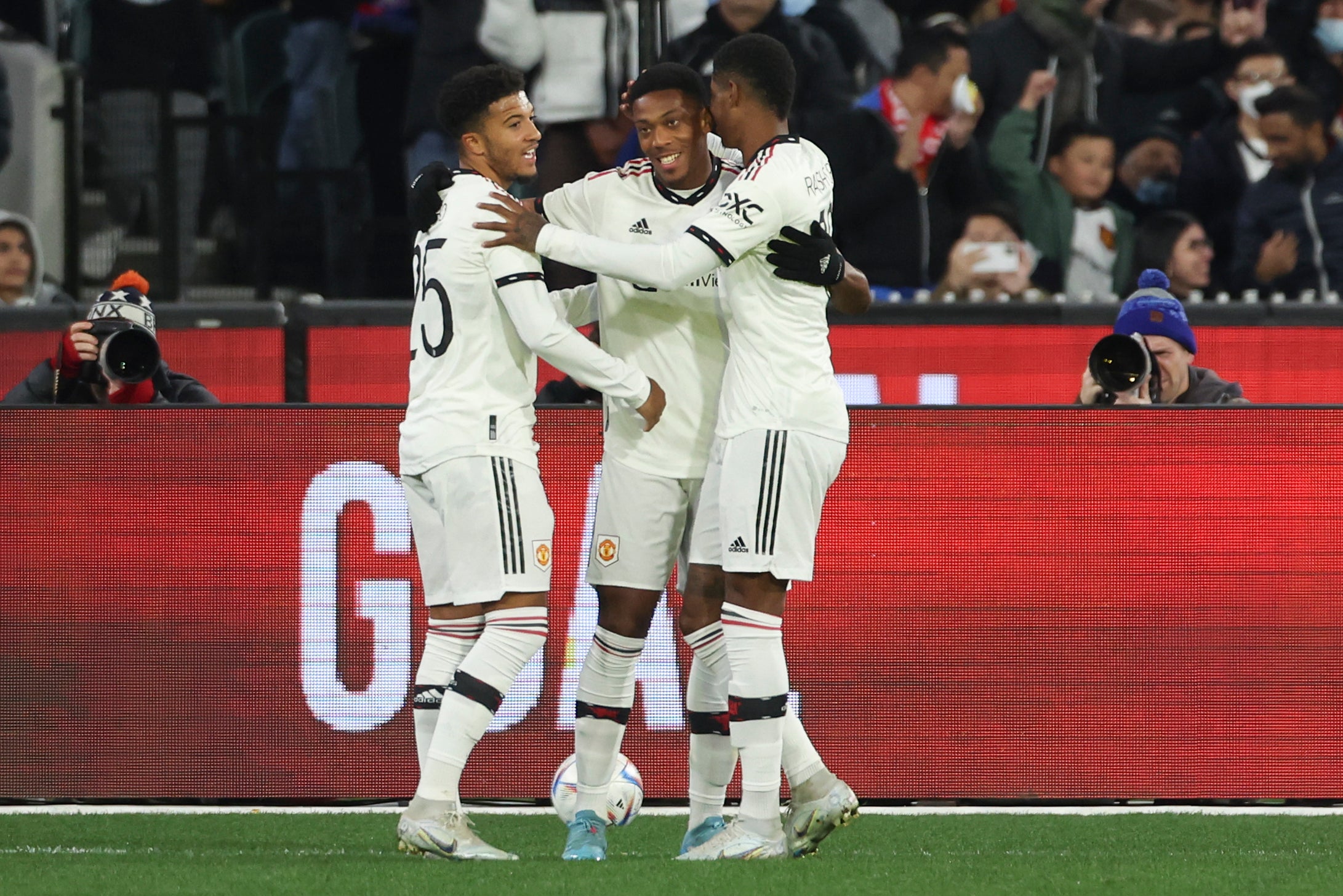 Martial celebrates with Sancho and Rashford