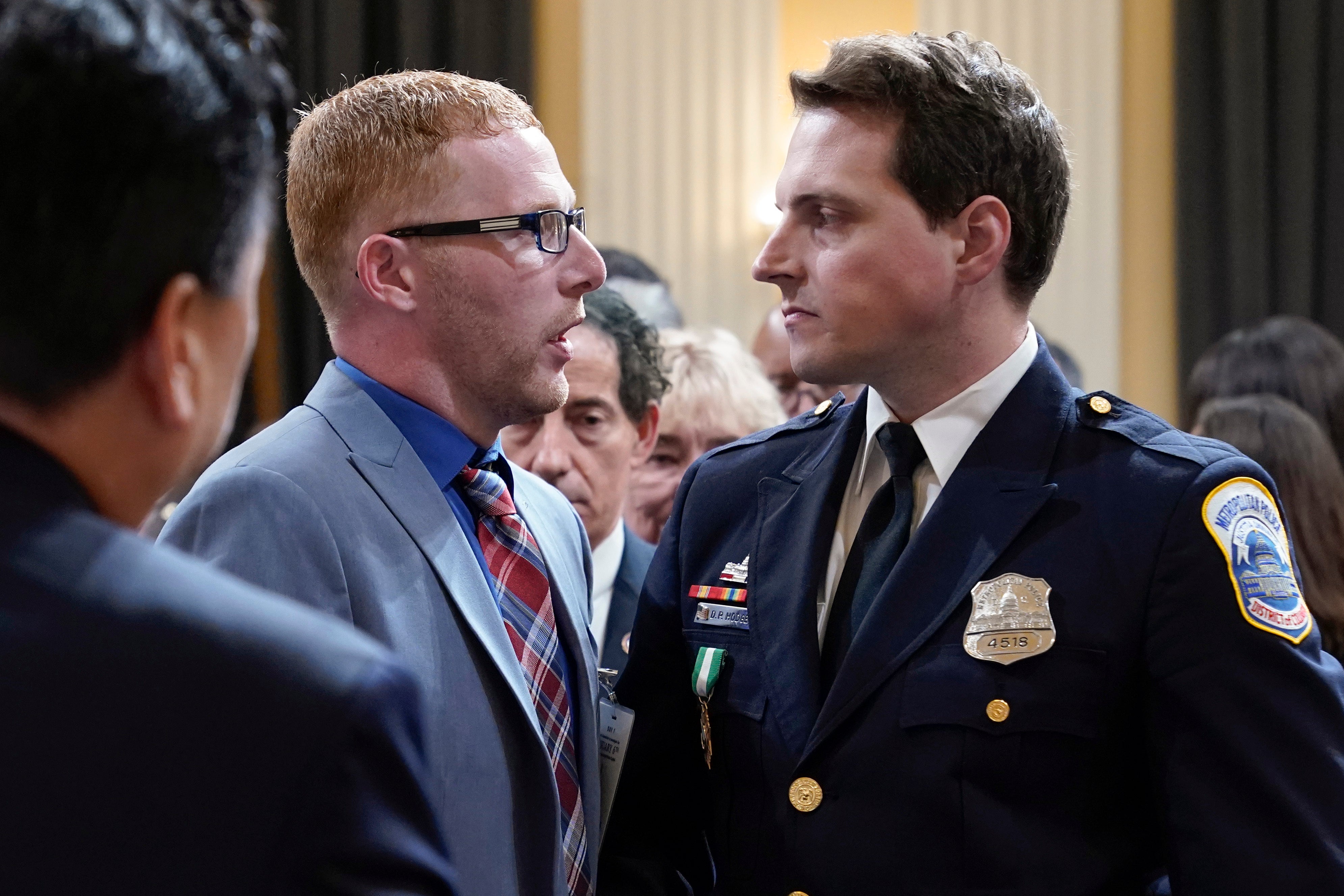 Stephen Ayres, who joined the pro-Trump mob that attacked the U.S. Capitol on Jan. 6 and has since plead guilty to disorderly and disruptive conduct in a restricted building, shakes hands during an apology to Washington Metropolitan Police Department officer Daniel Hodges